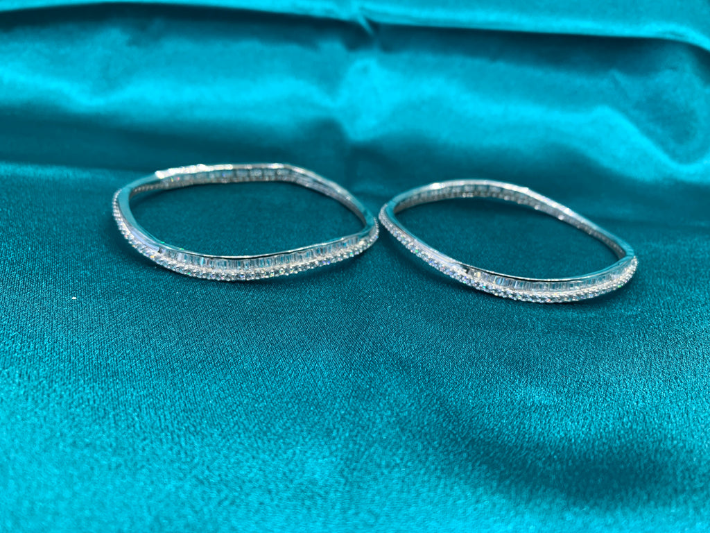Elegant CZ diamond silver bangles in wavy design