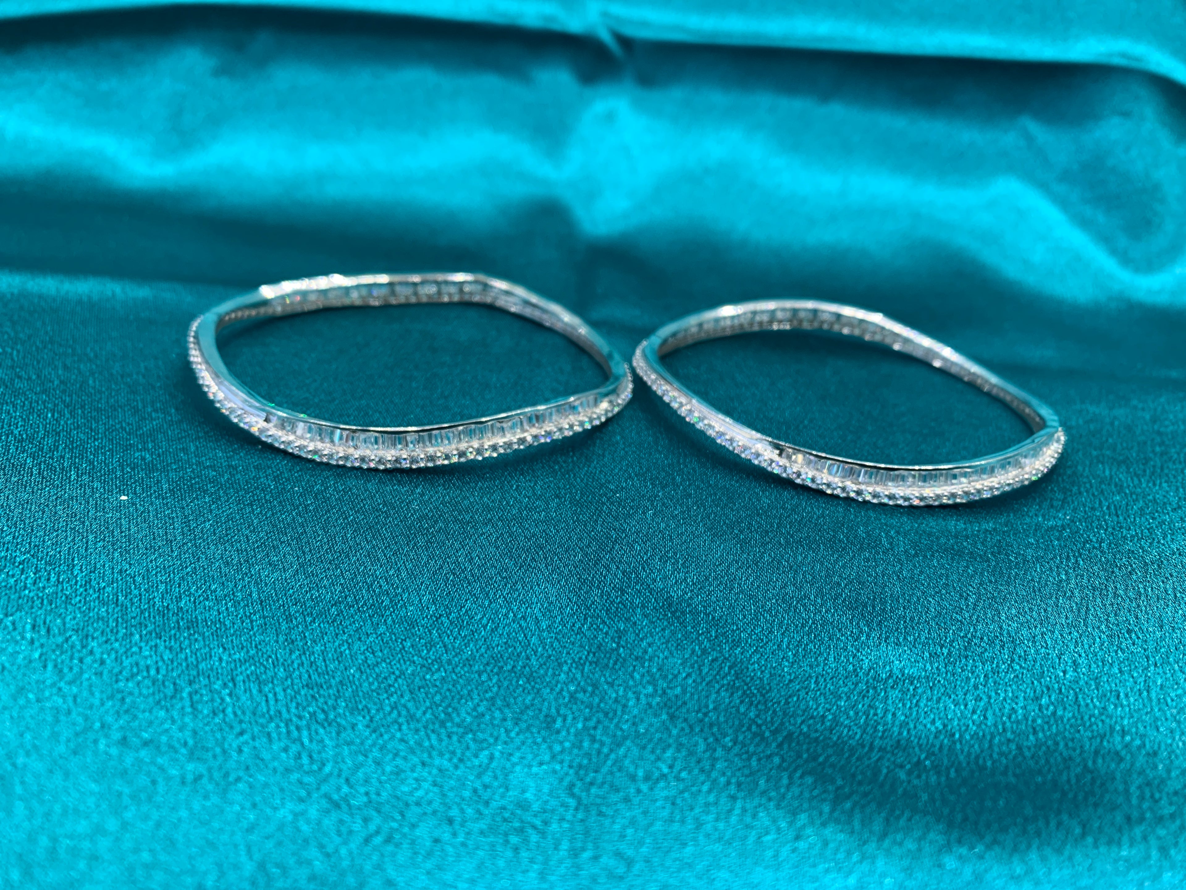 Elegant CZ diamond silver bangles in wavy design