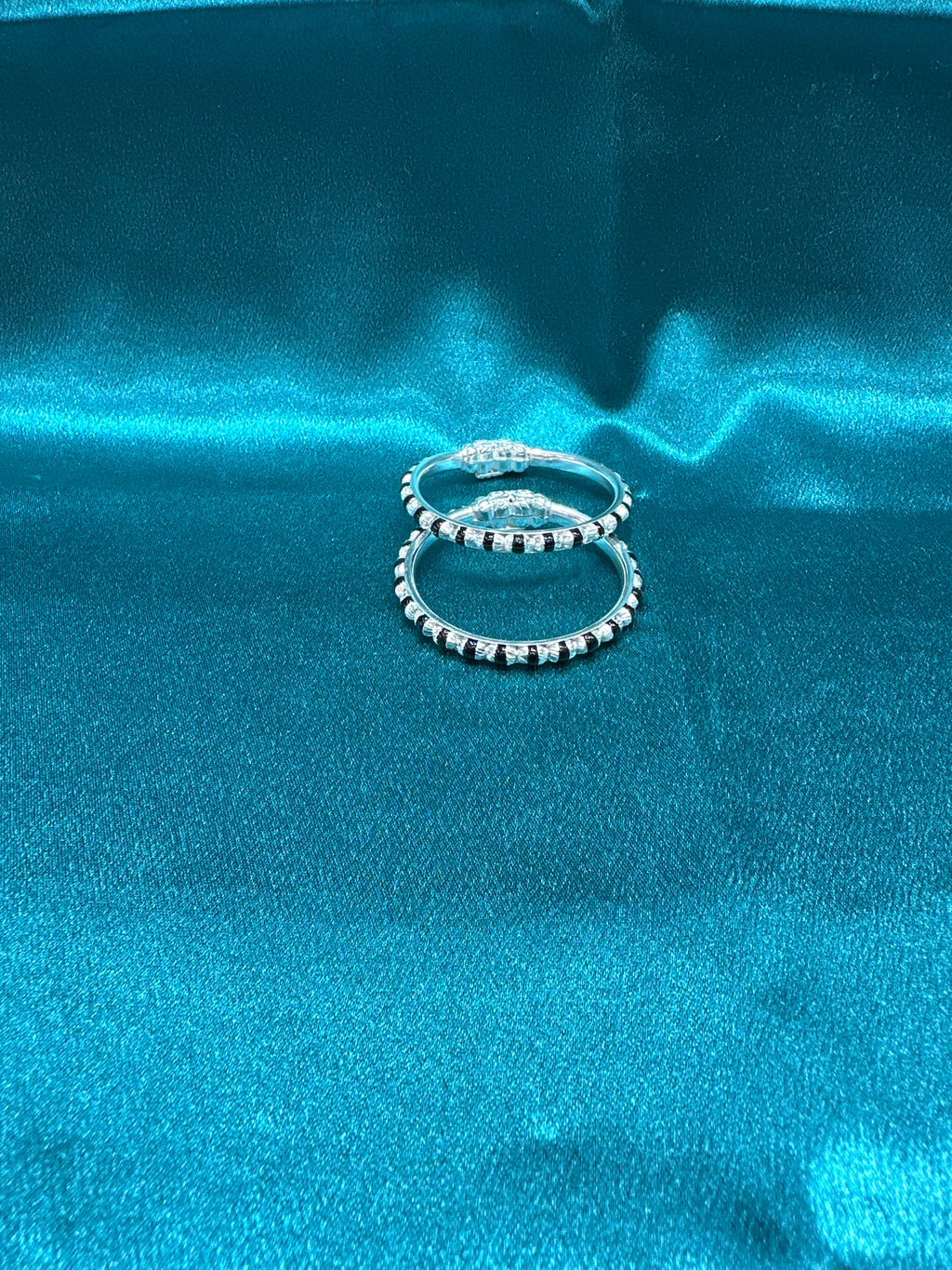Silver baby bangles with black beads