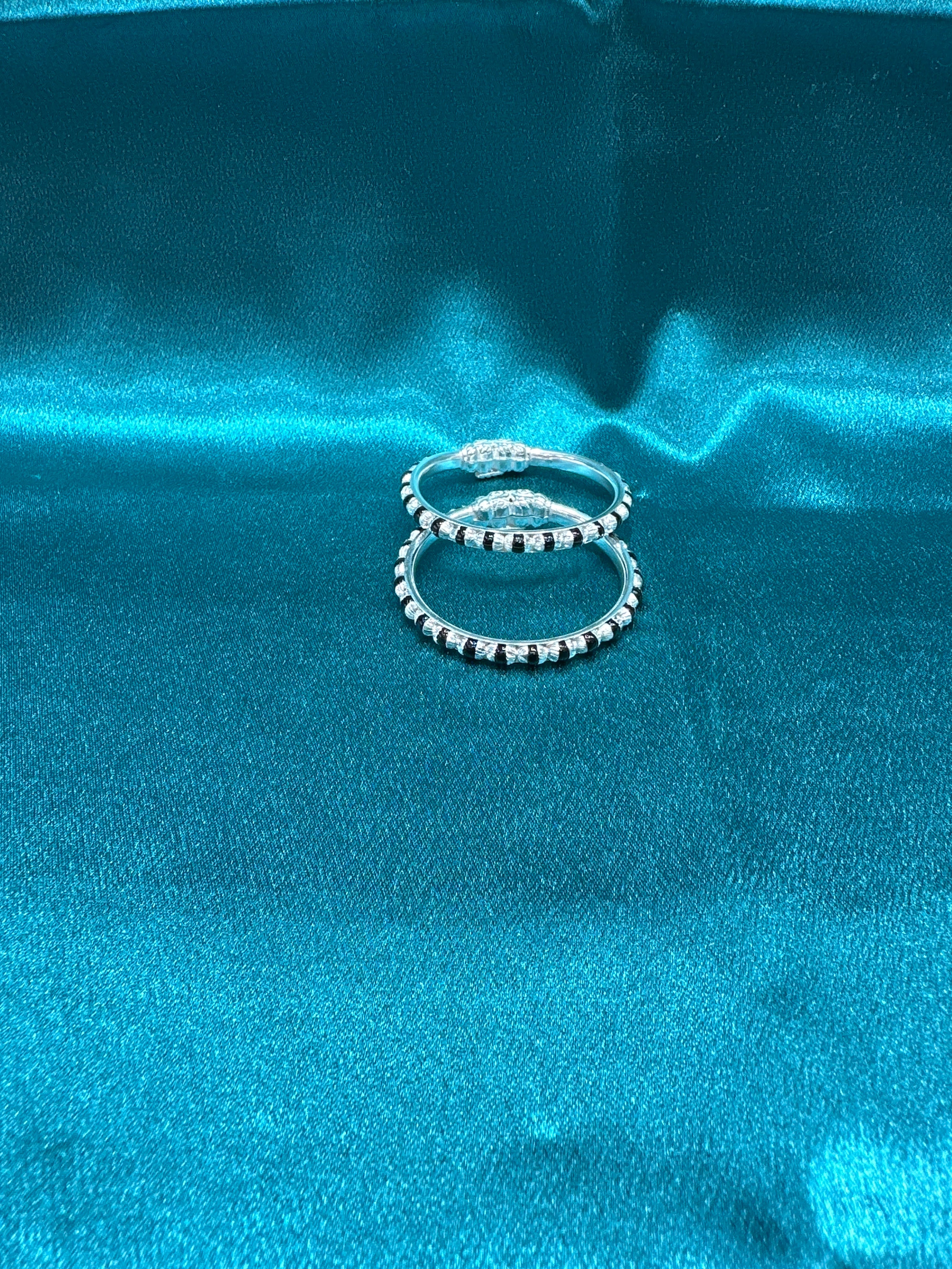 Silver baby bangles with black beads