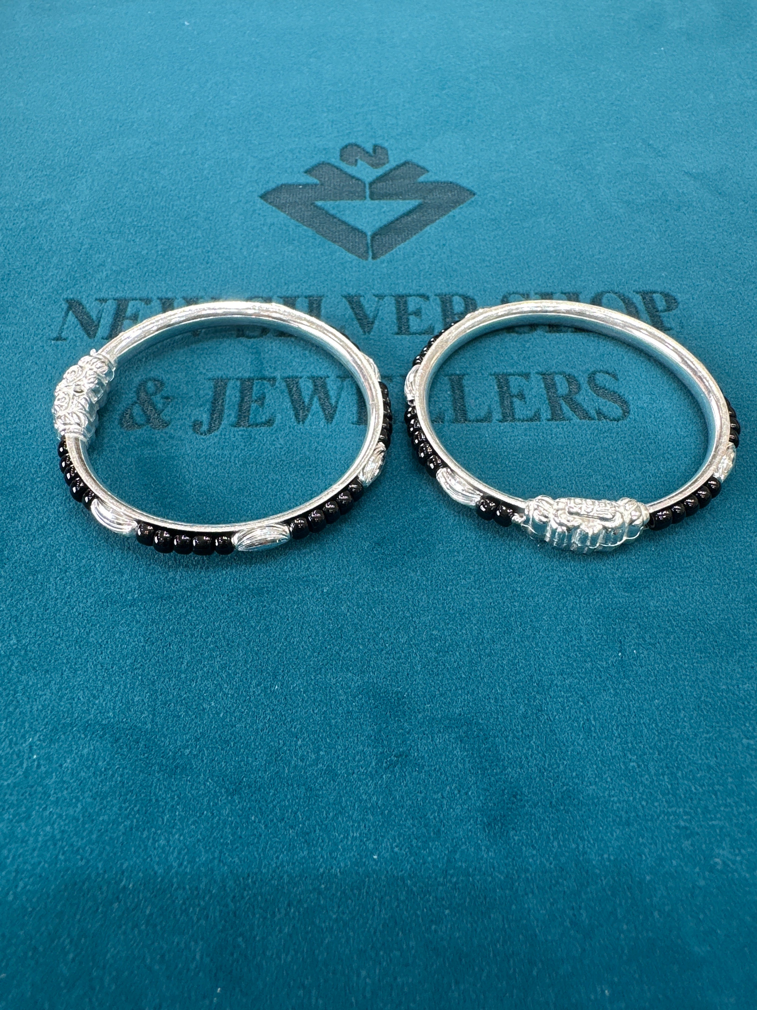 Silver baby bangles with black beads