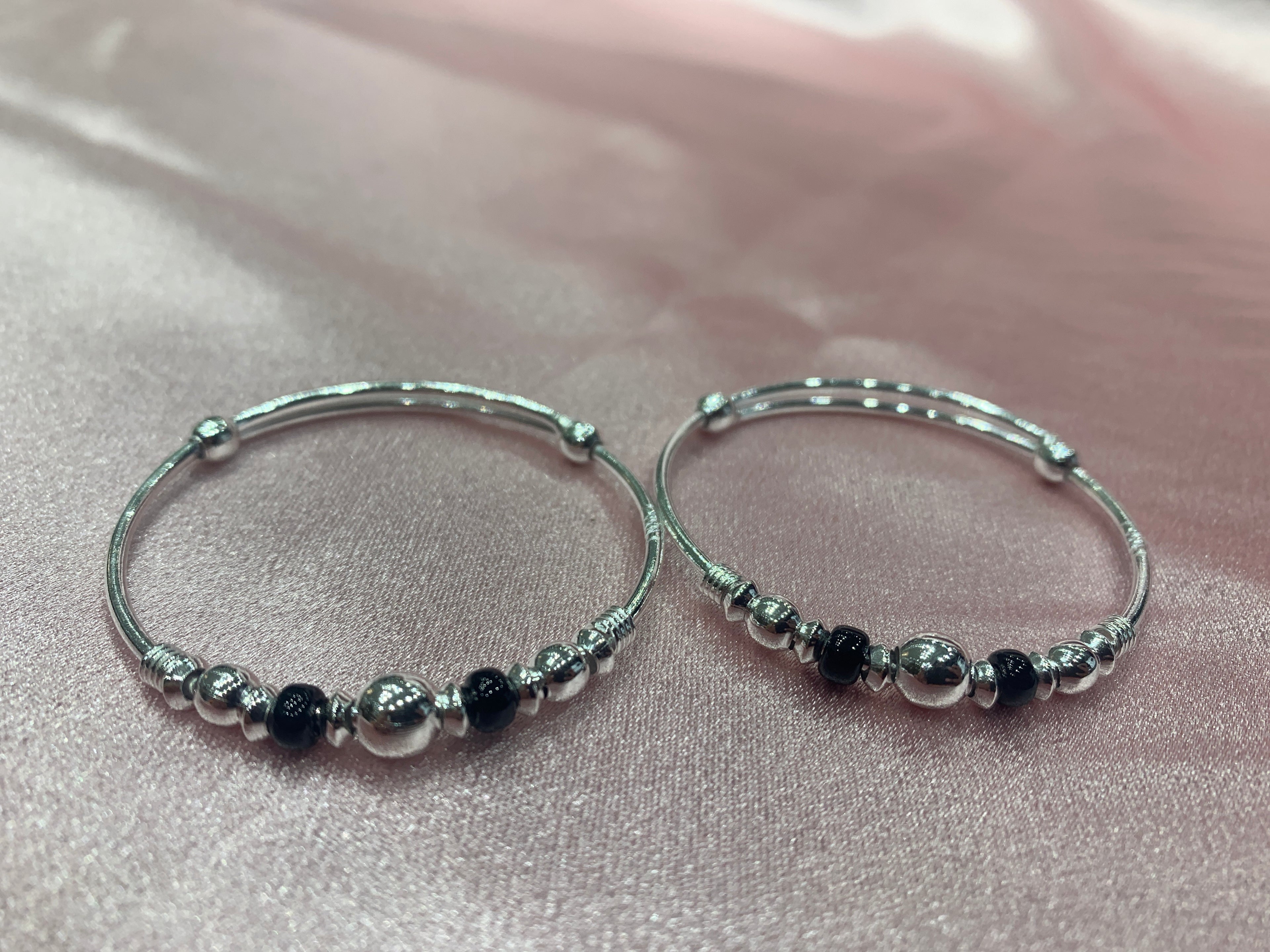 Silver baby bangles with black and silver beads