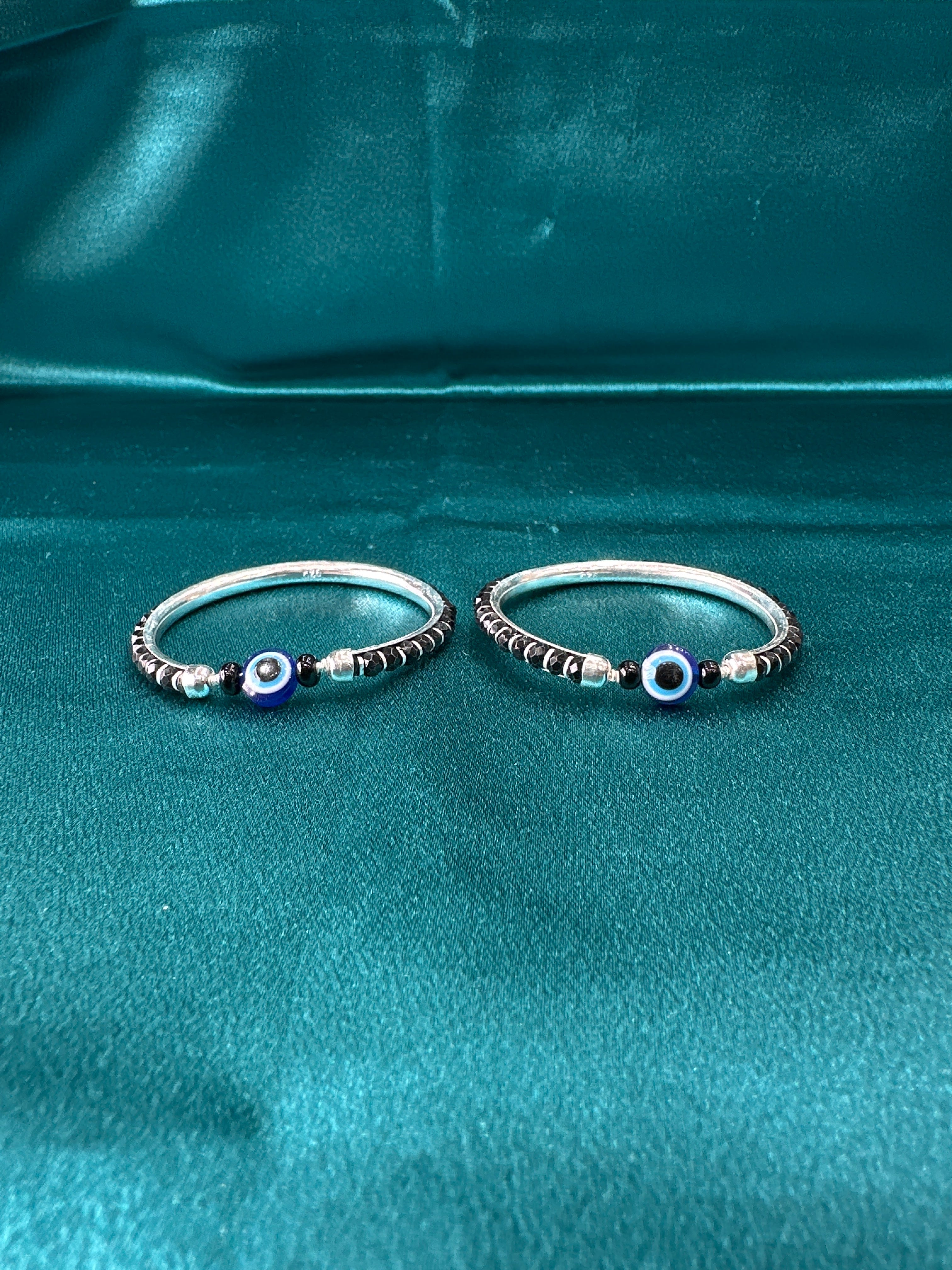 Silver baby bangles with black beads