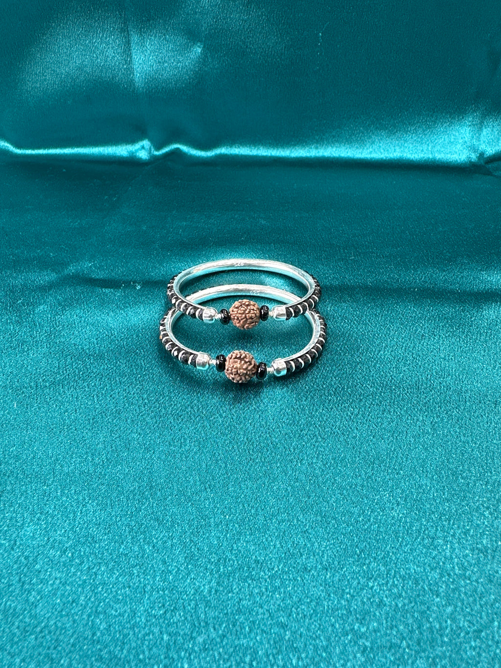 Silver baby bangles with black beads