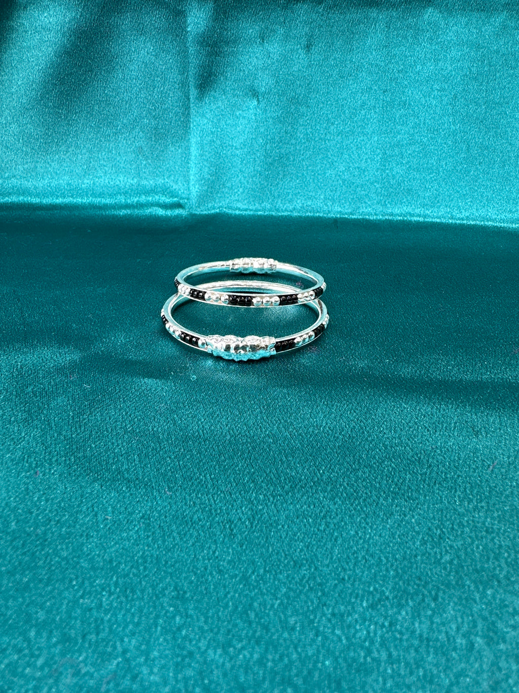 Silver baby bangles with black beads