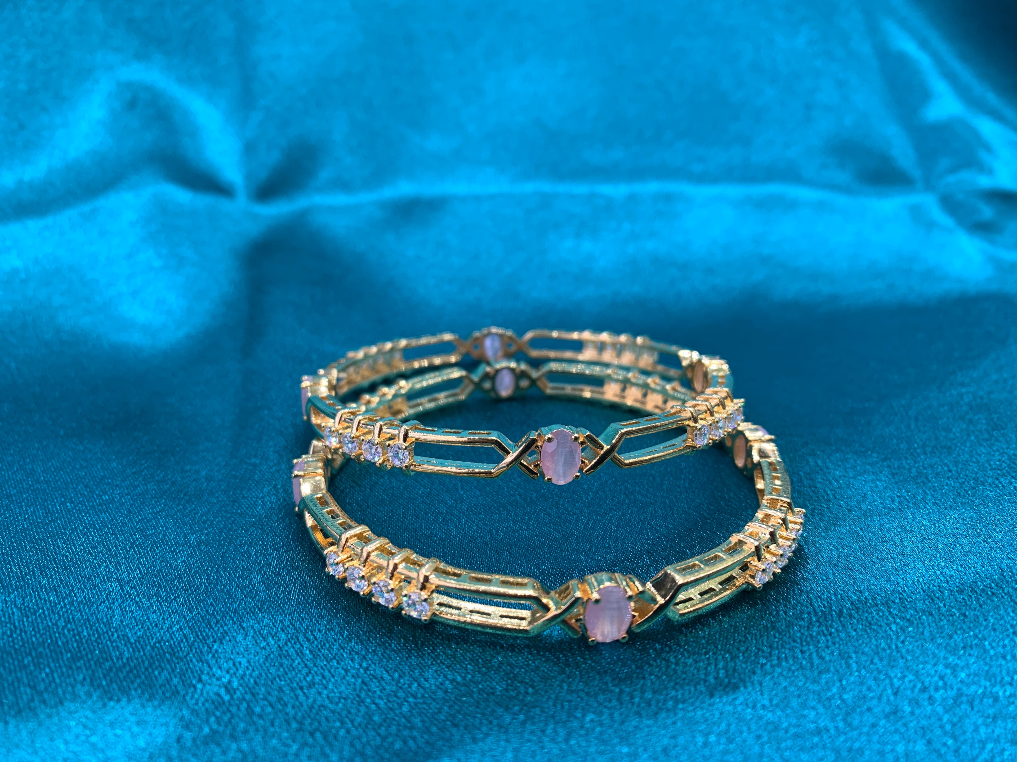 Dazzling gold plated silver bangles with peach CZ diamonds