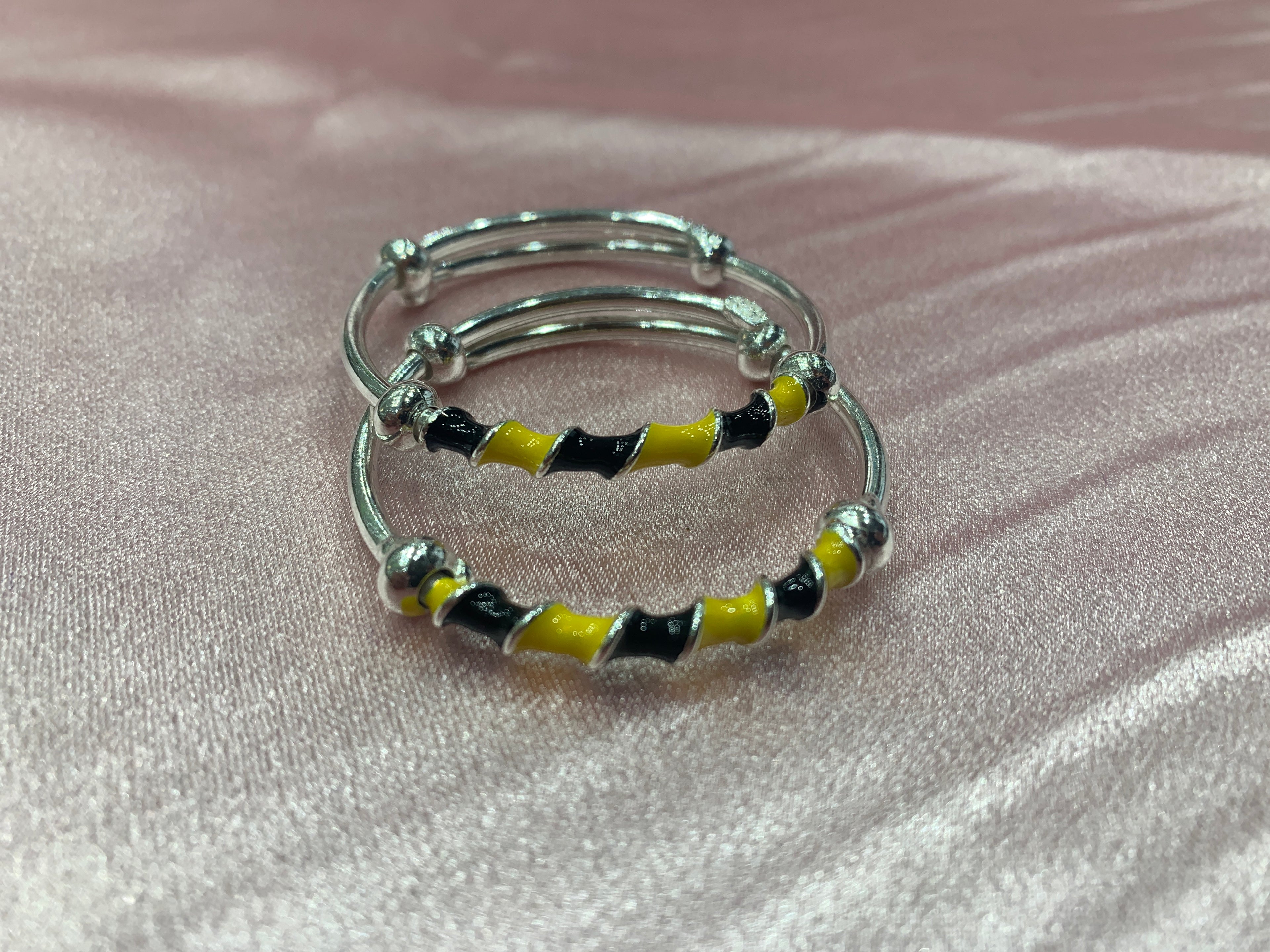 Silver baby bangles in black and yellow colour