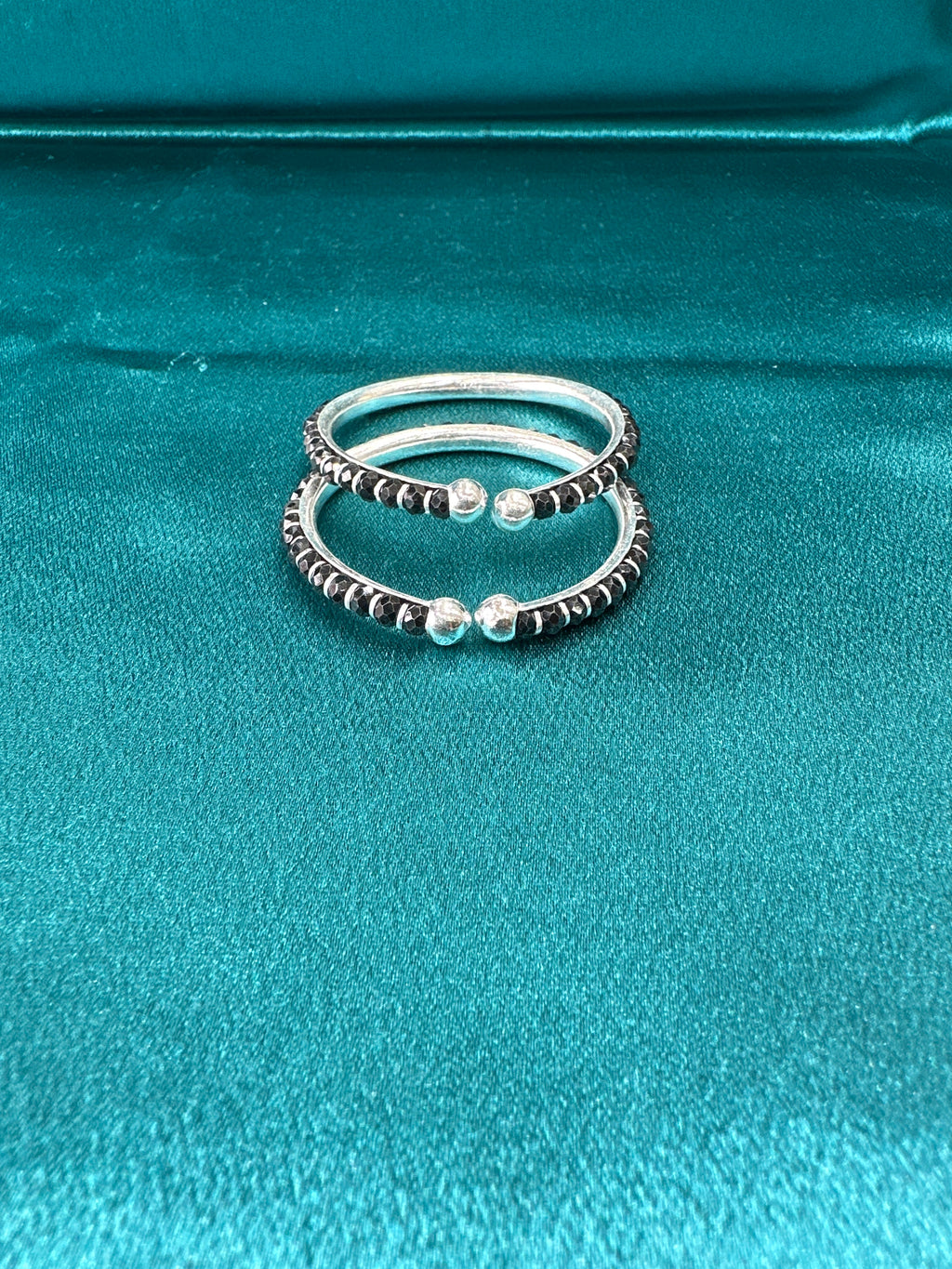 Silver baby bangles with black beads