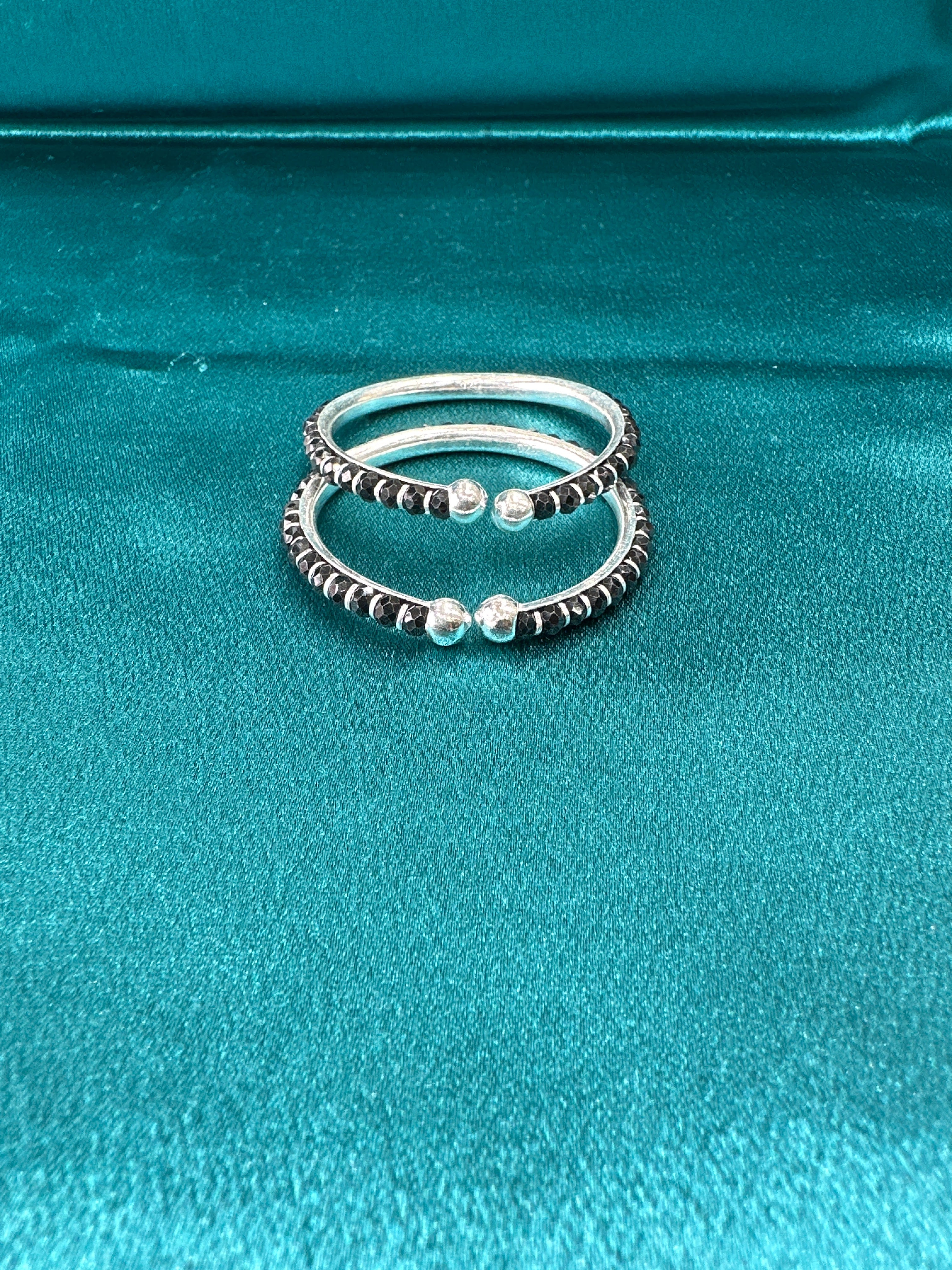 Silver baby bangles with black beads