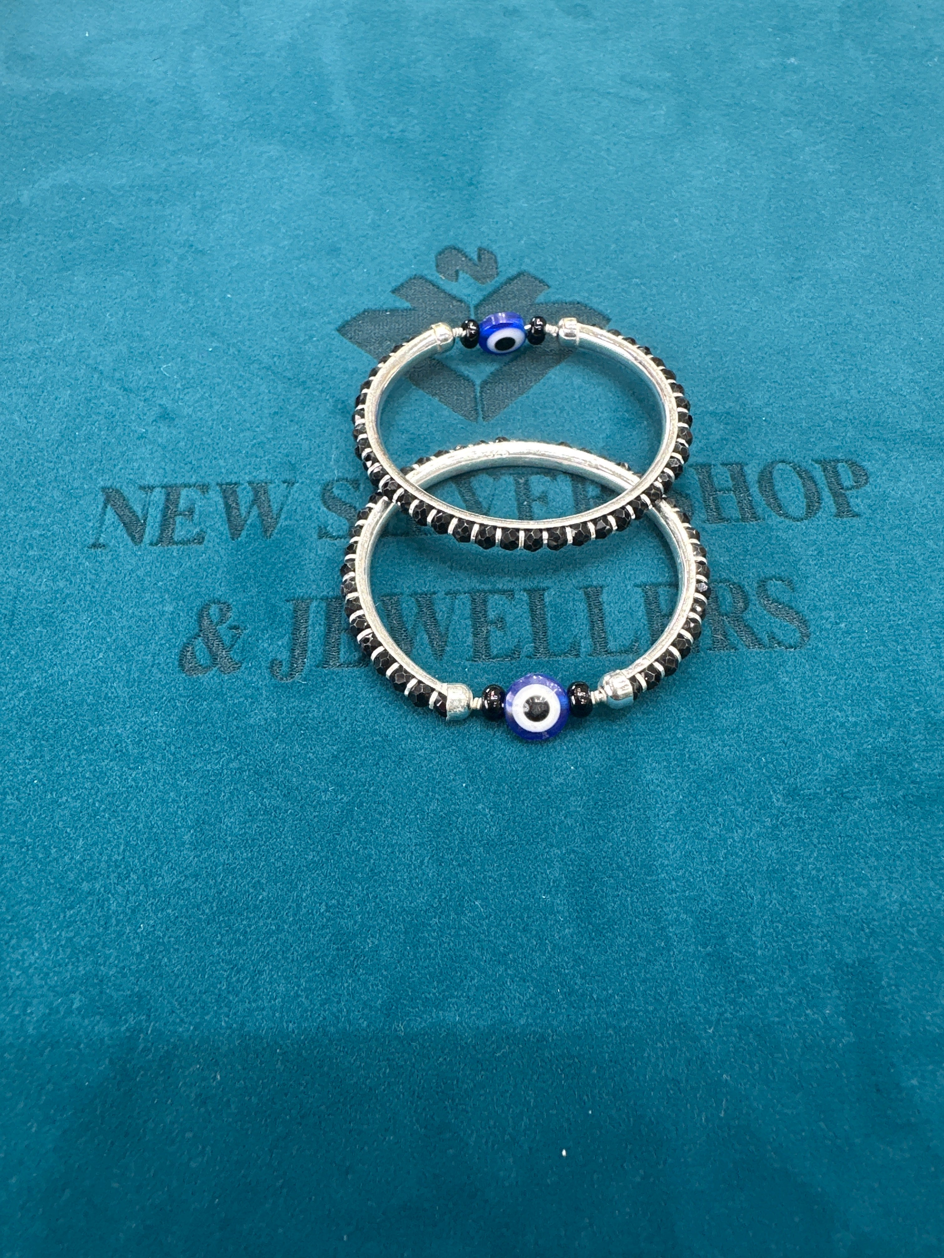 Silver baby bangles with black beads