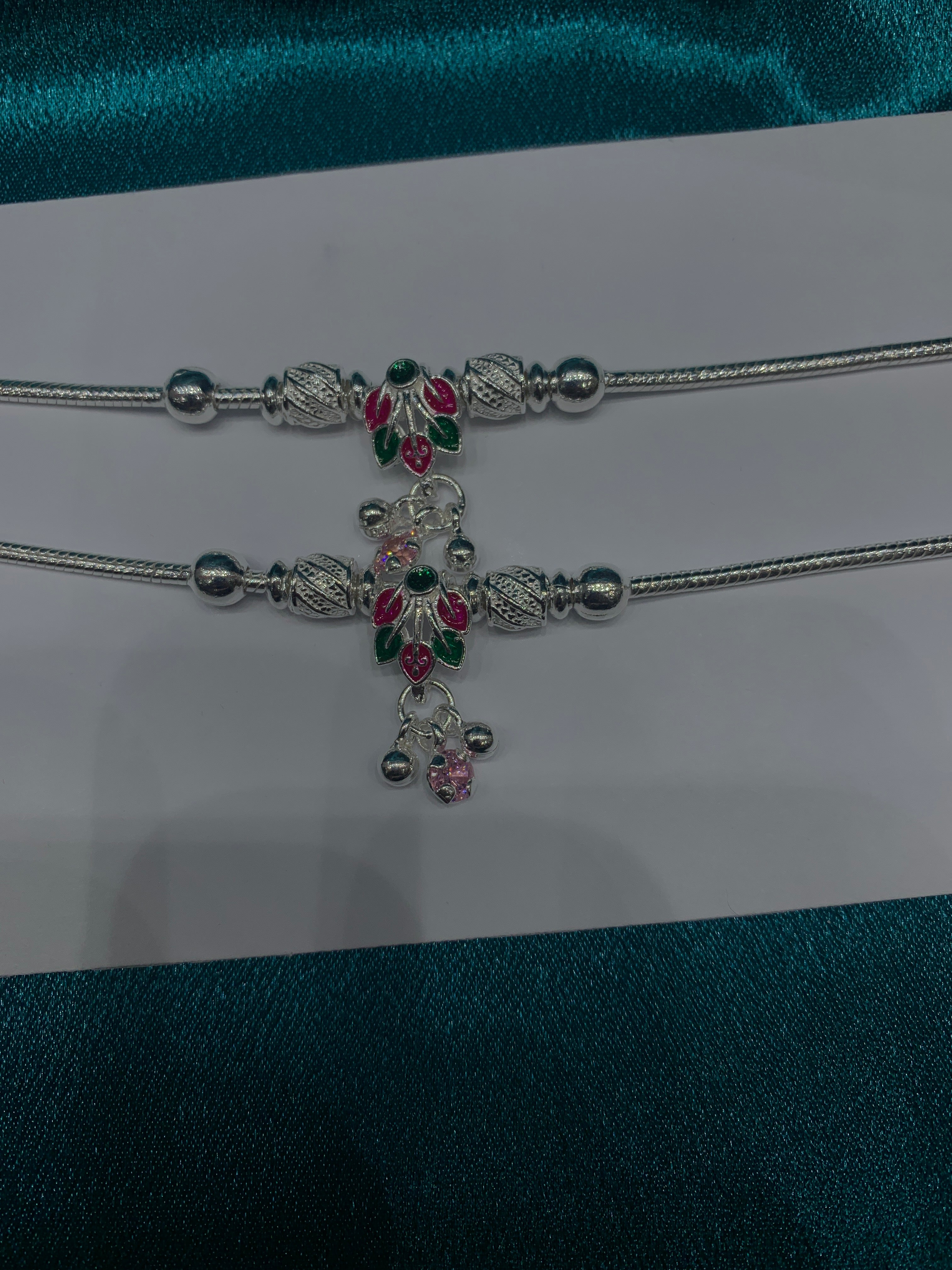 Fancy silver anklets with flower petals design