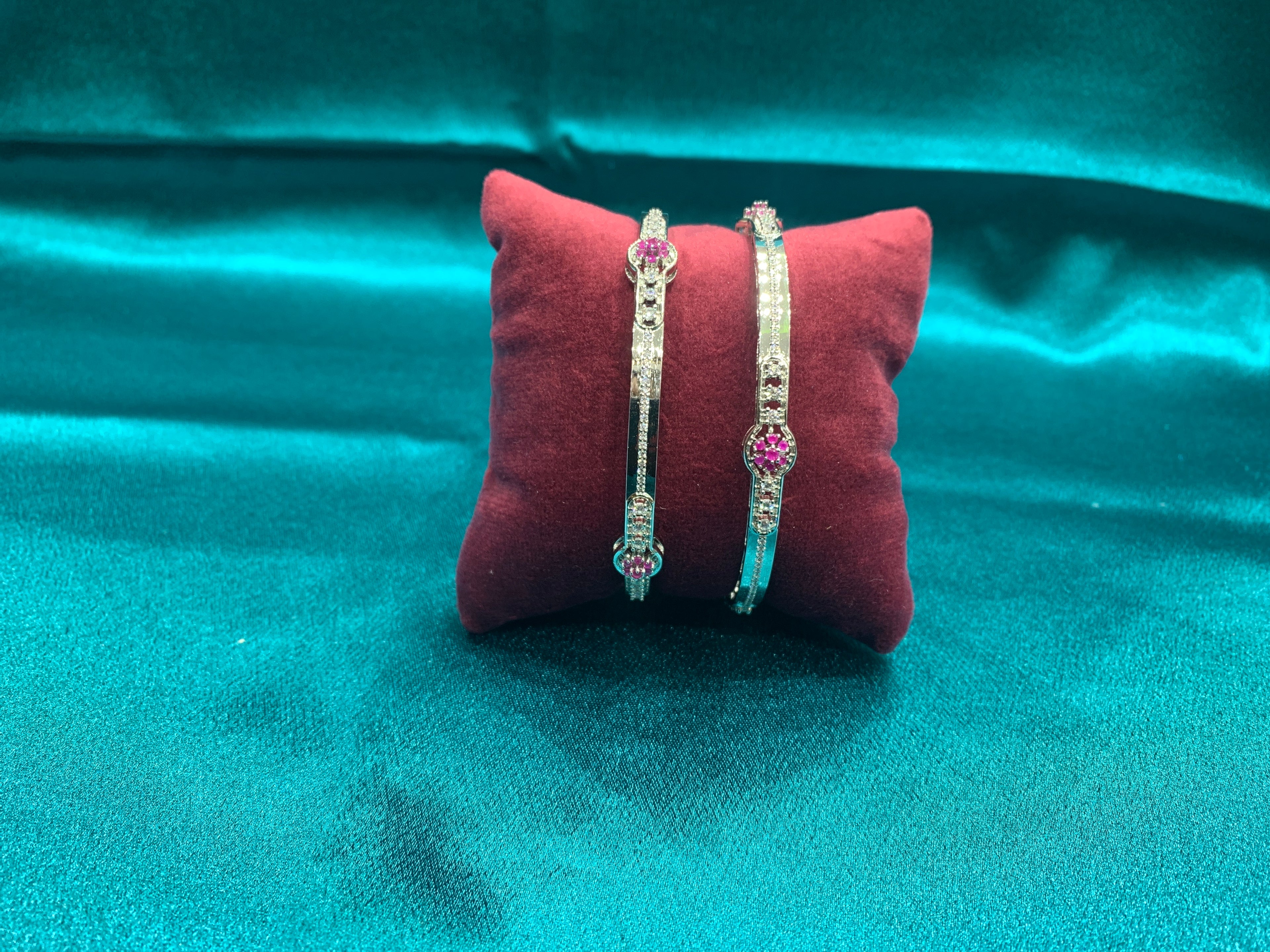 Elegant CZ diamond silver bangles with pink stones in flower pattern
