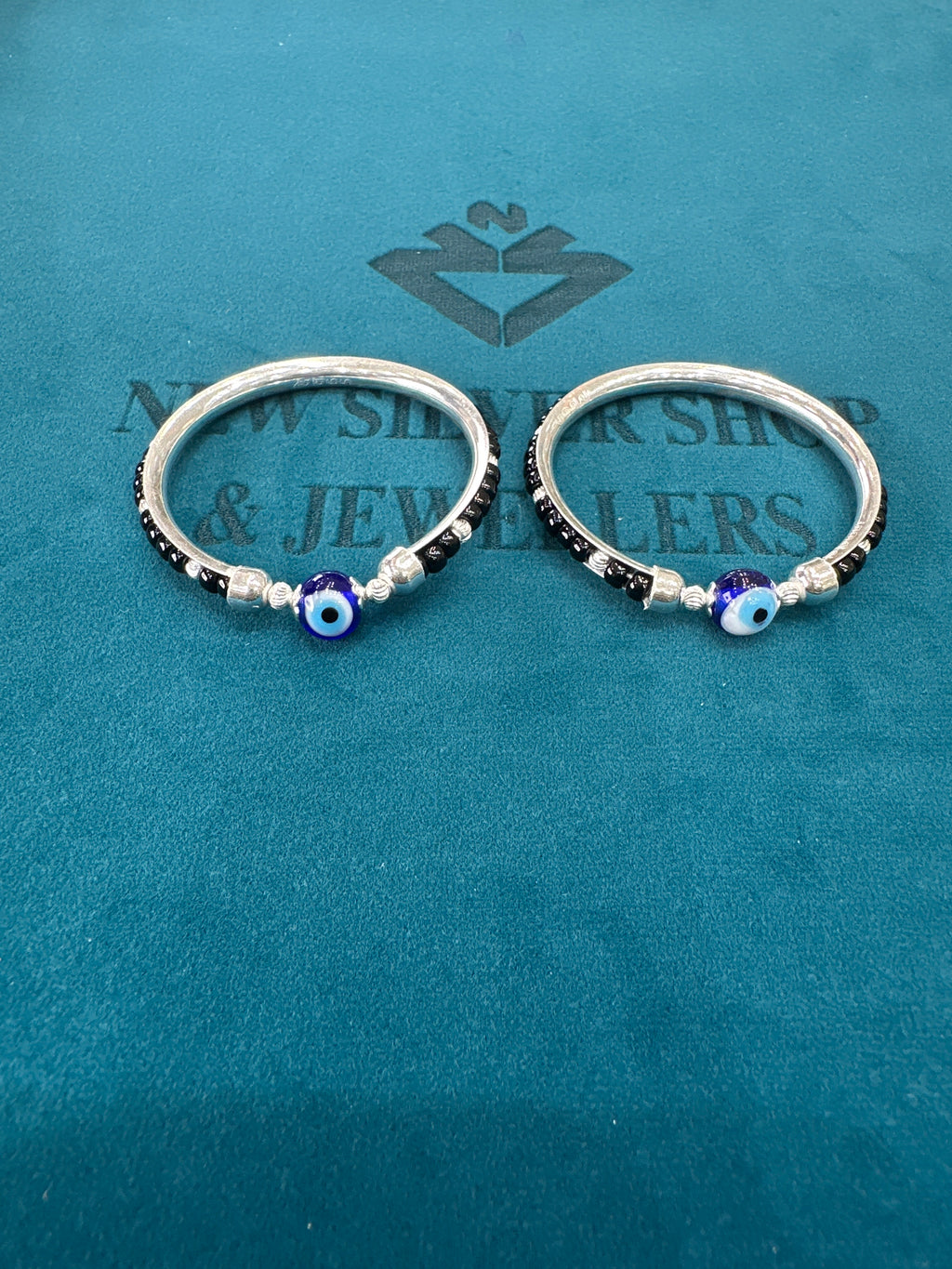 Silver baby bangles with black beads