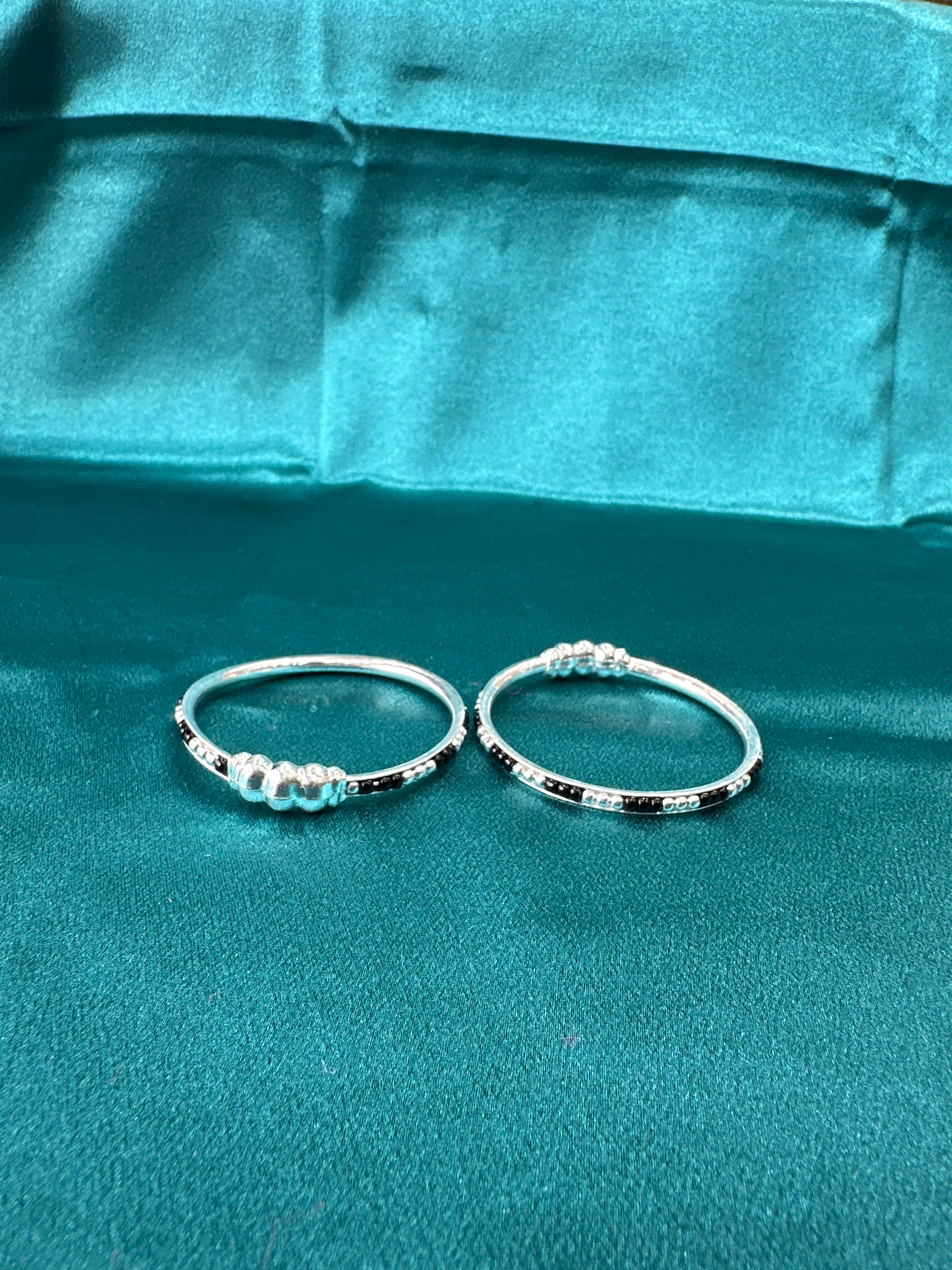 Silver baby bangles with black beads