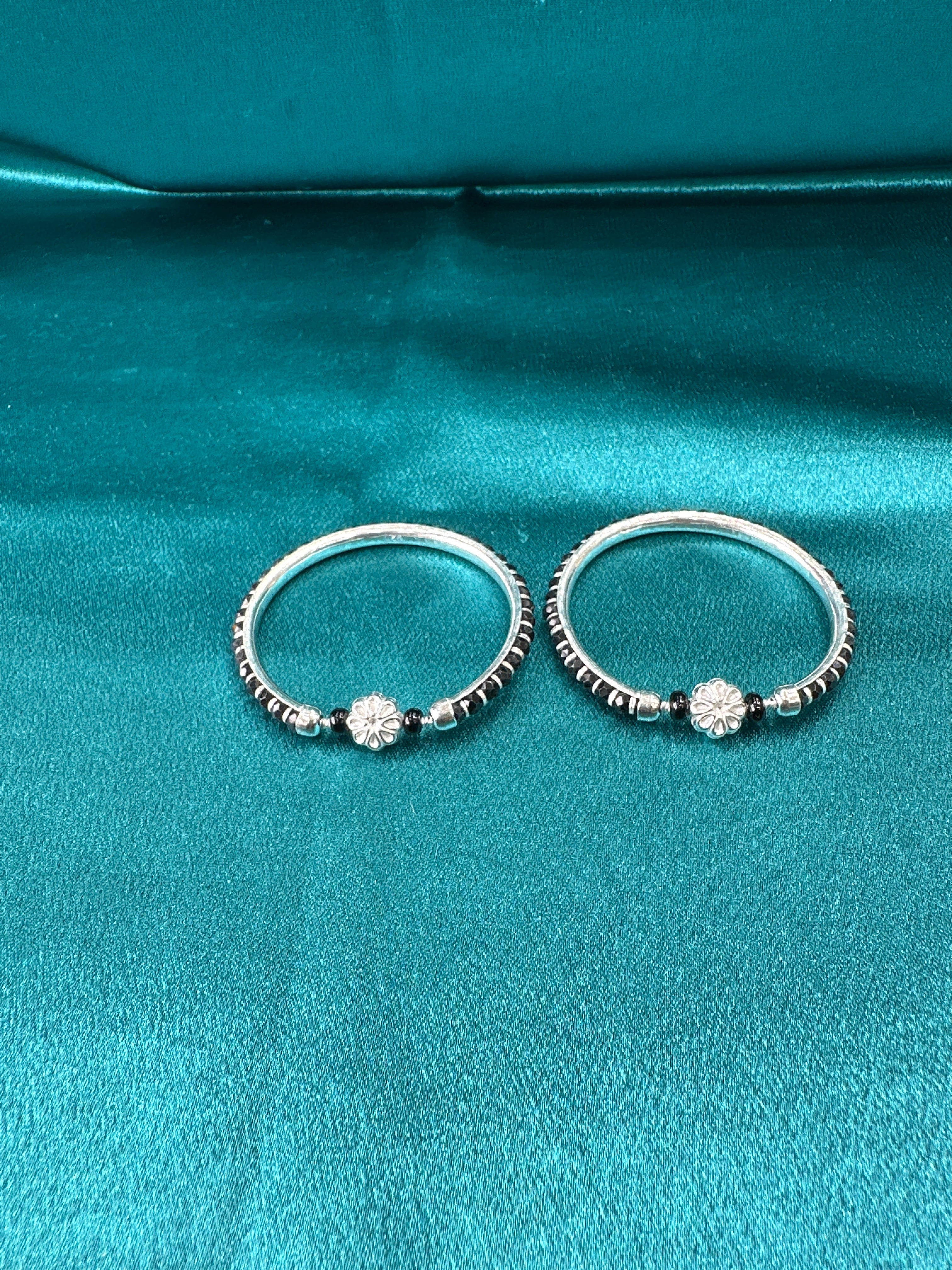 Silver baby bangles with black beads