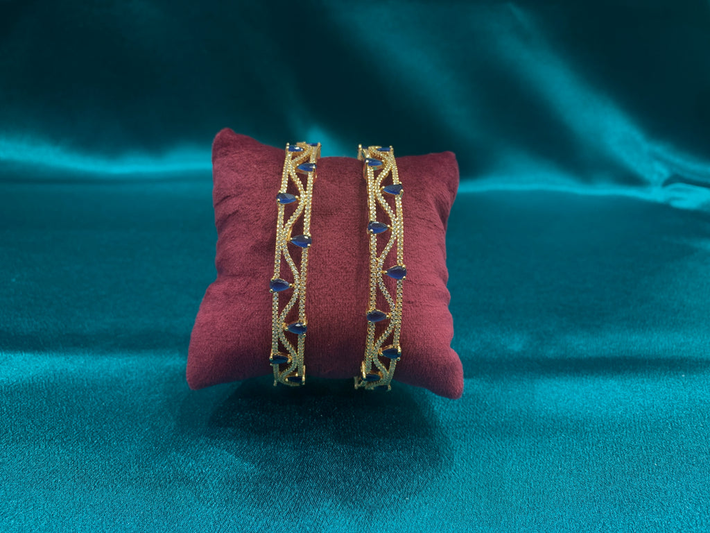Dazzling gold plated silver bangles with tear drop blue CZ diamonds