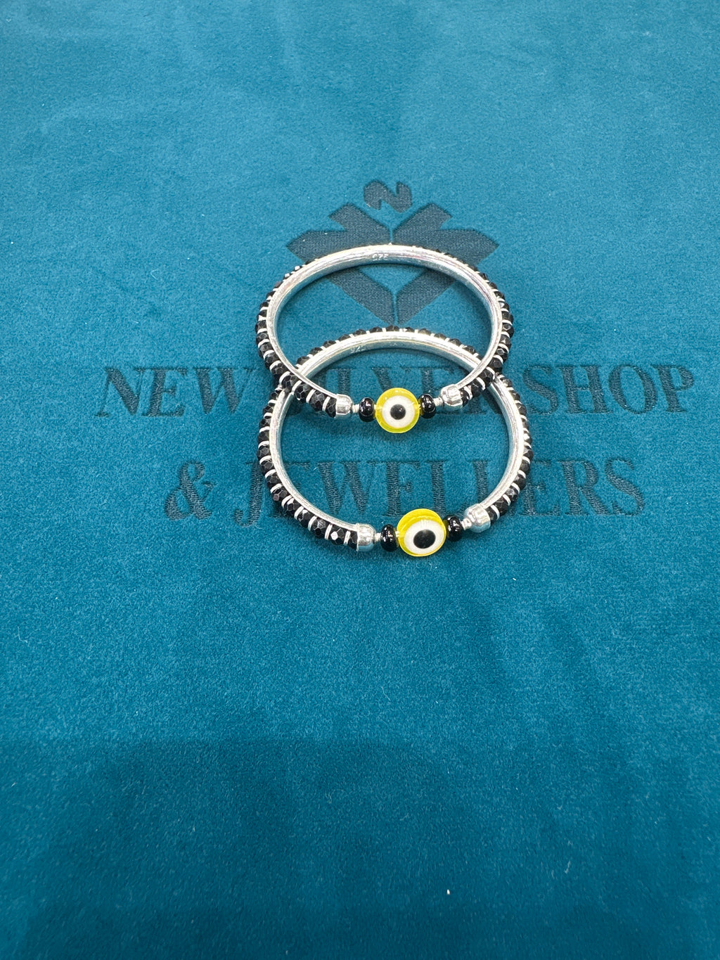 Silver baby bangles with black beads