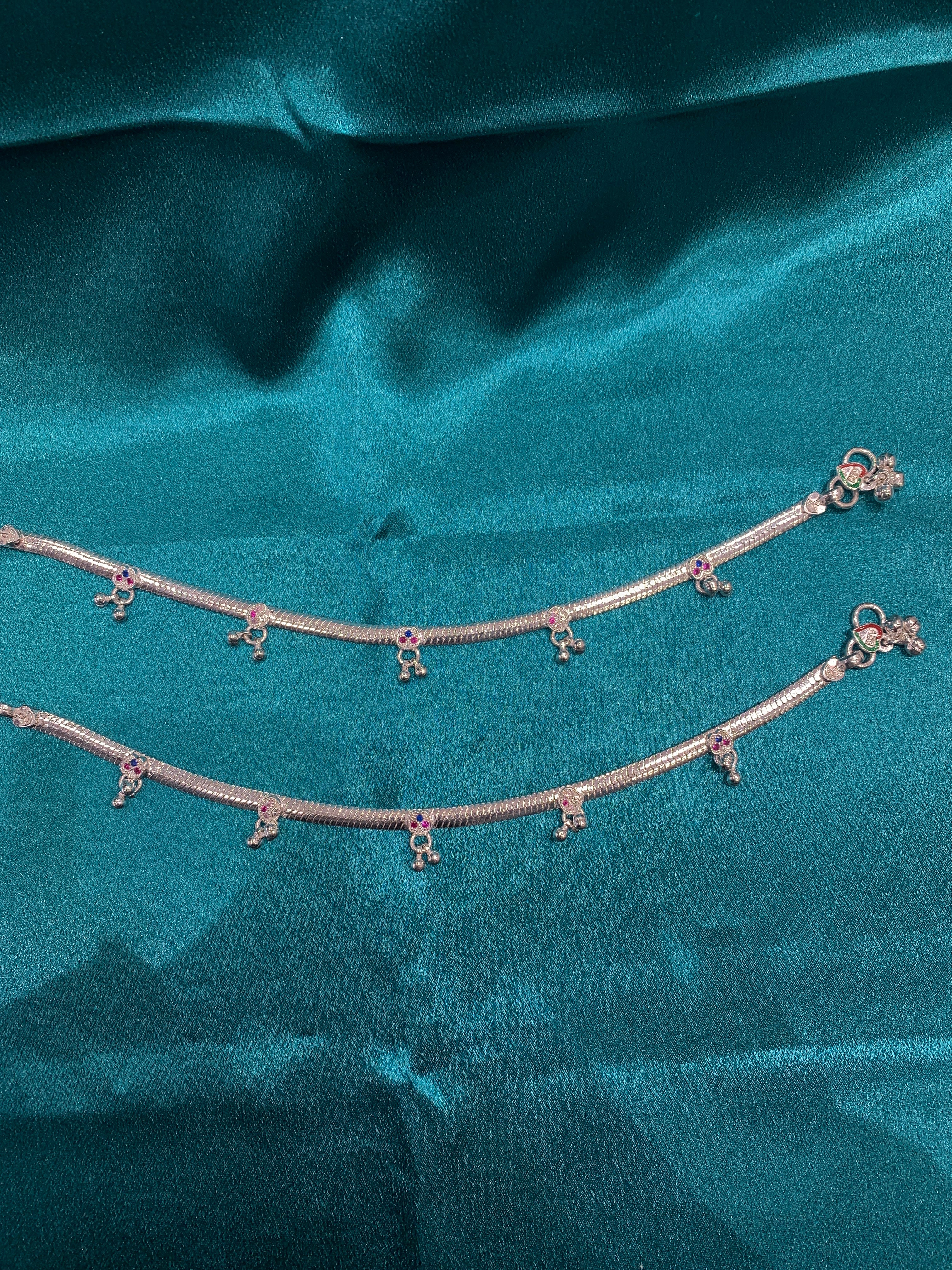 Traditional silver anklets with blue and pink CZ diamonds and hanging bells
