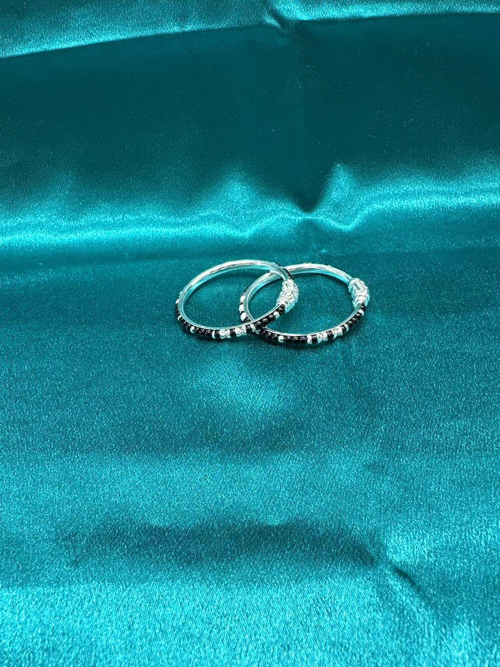 Silver baby bangles with black beads