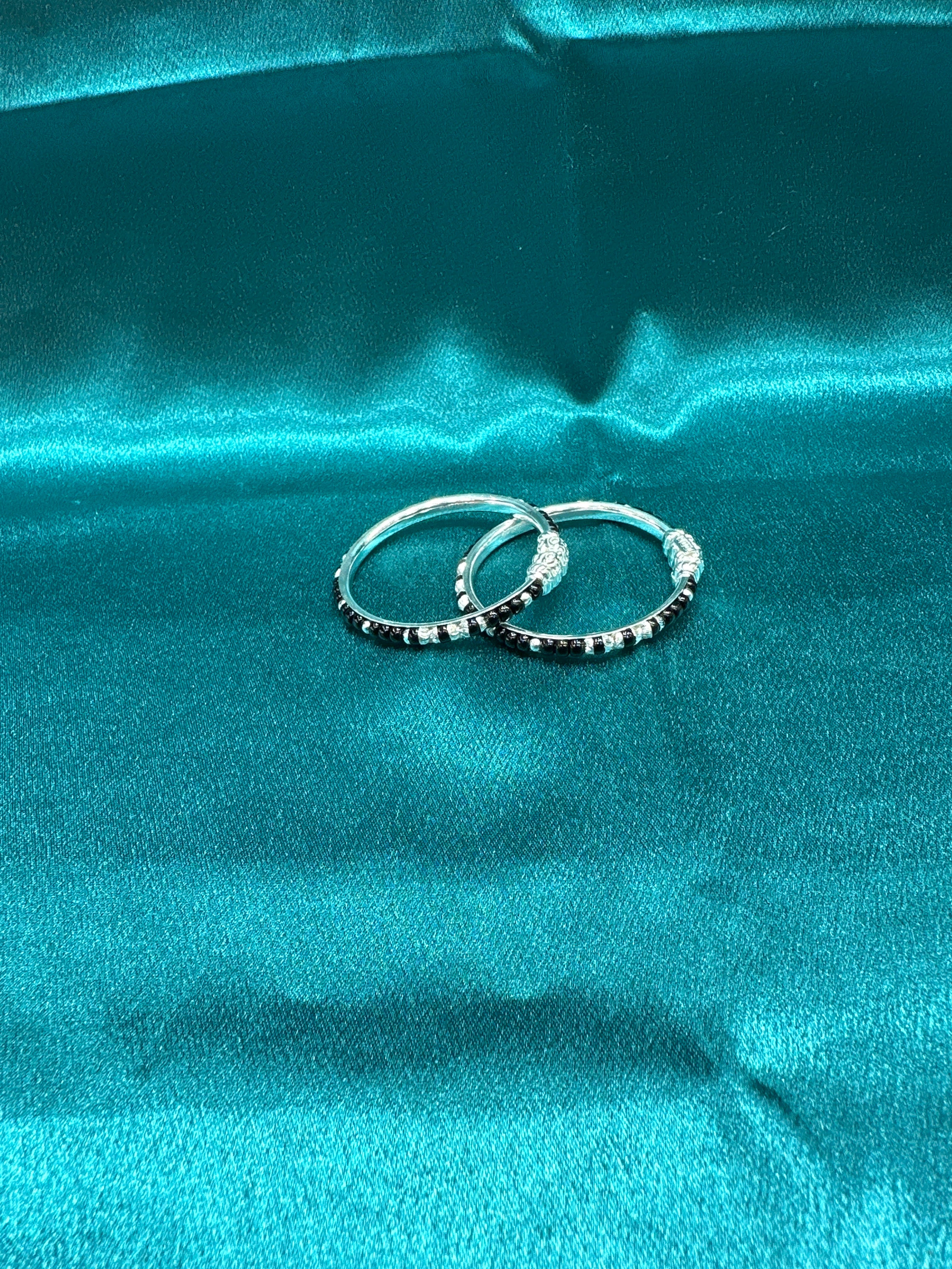 Silver baby bangles with black beads