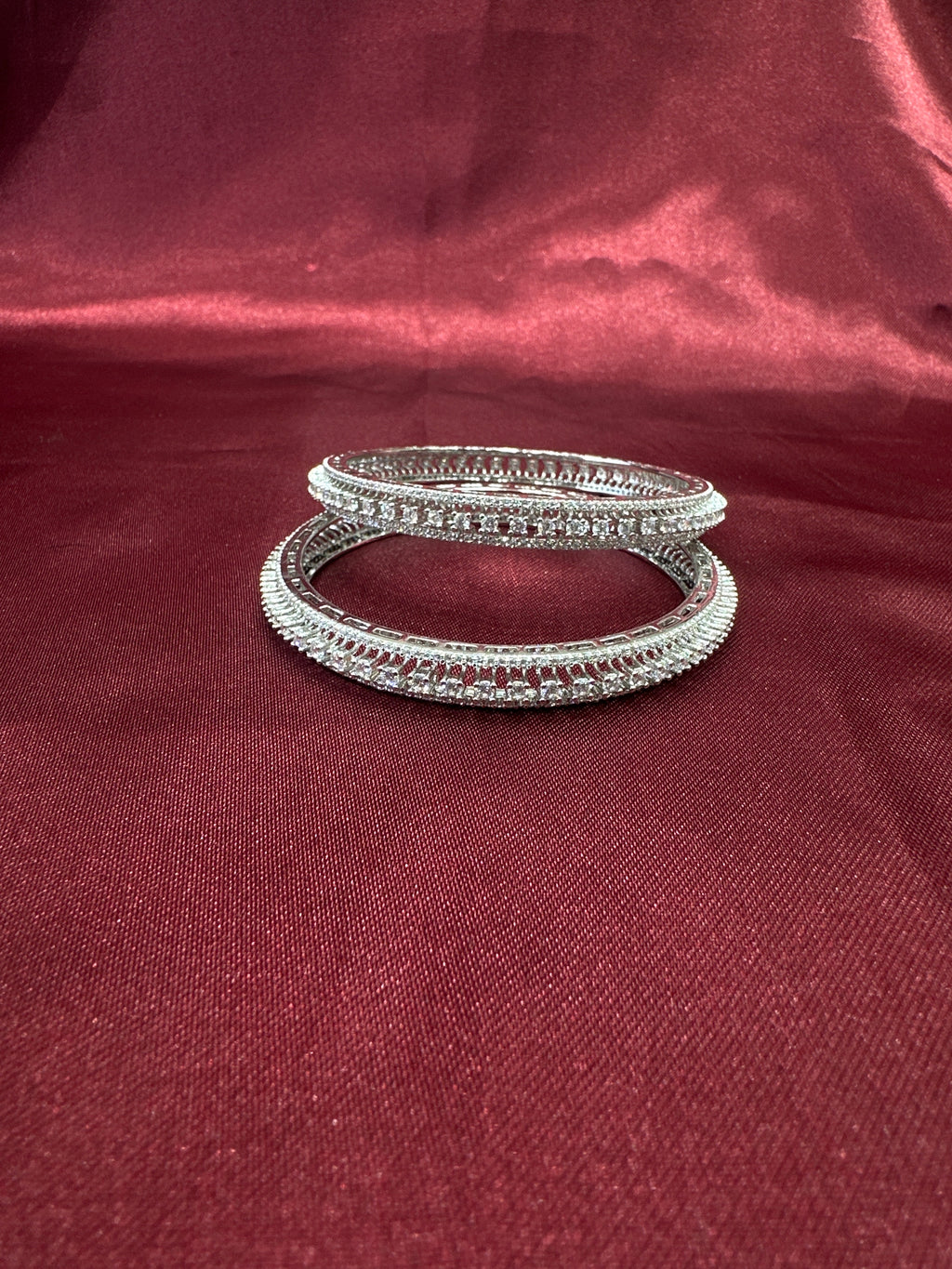 Elegant CZ diamond silver bangles with white stone in sequence design