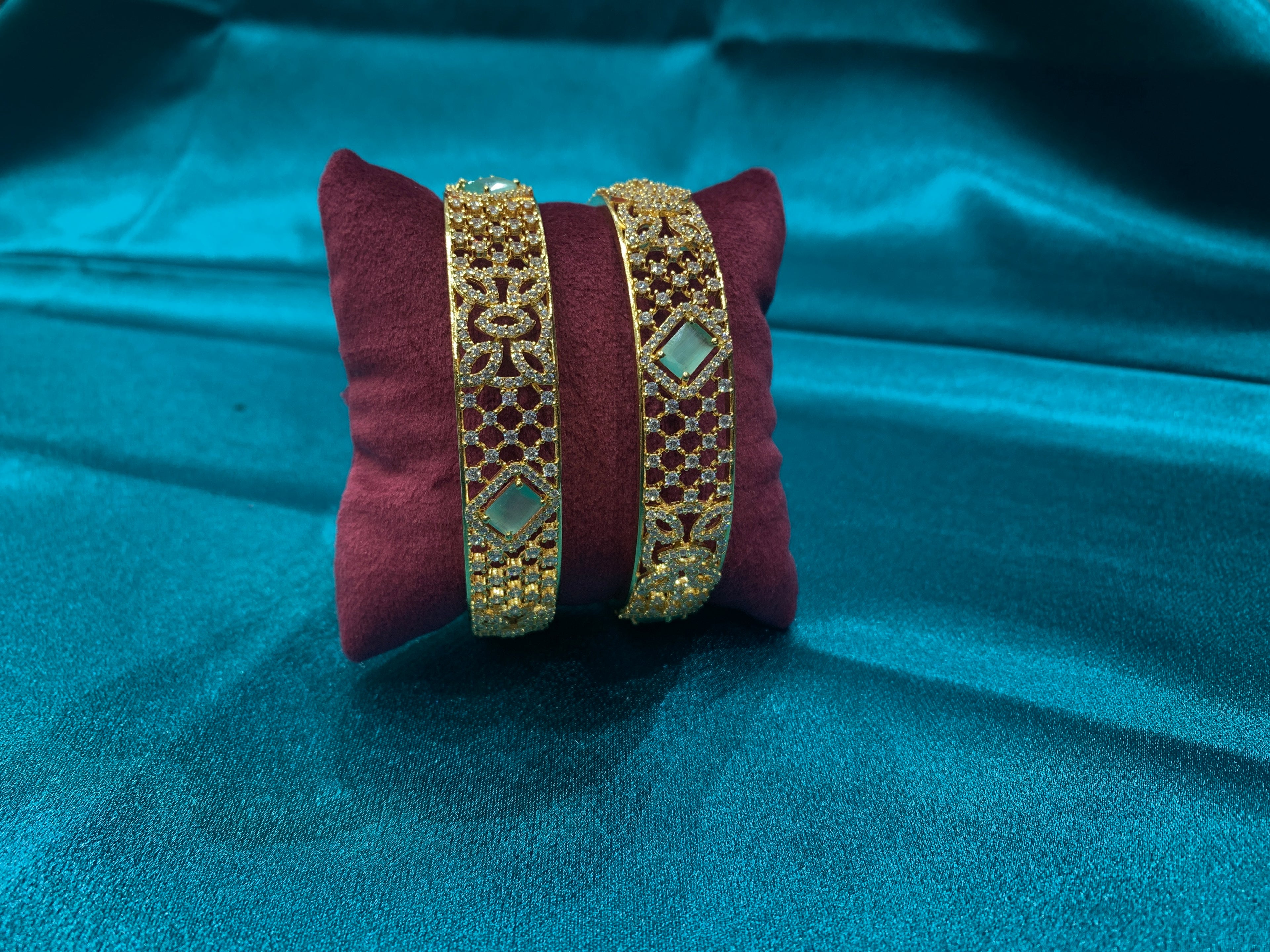 Dazzling Gold plated silver bangles with green CZ diamonds