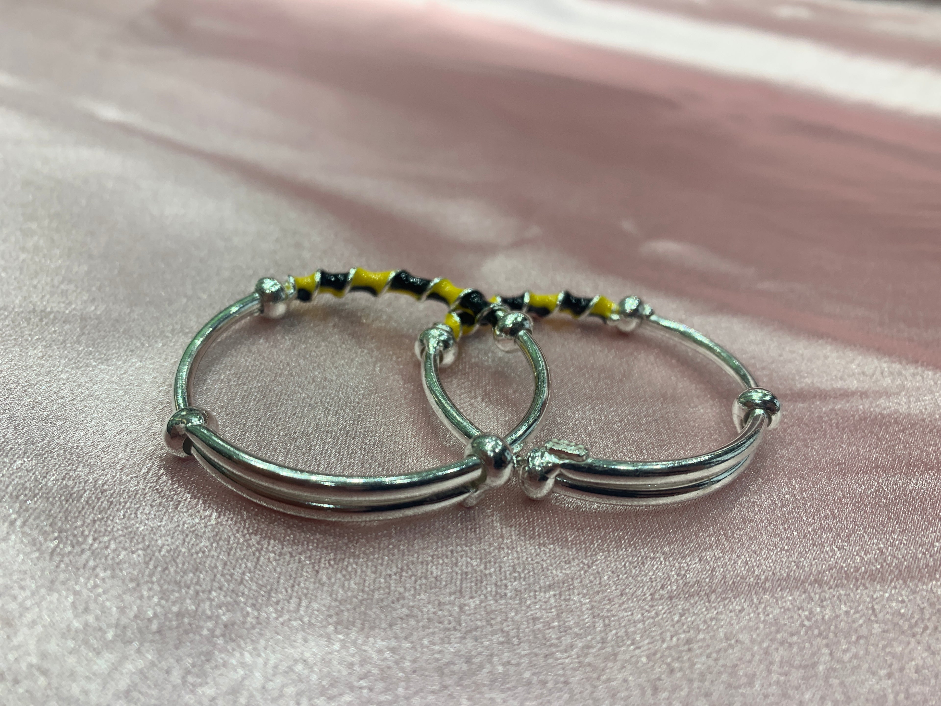 Silver baby bangles in black and yellow colour