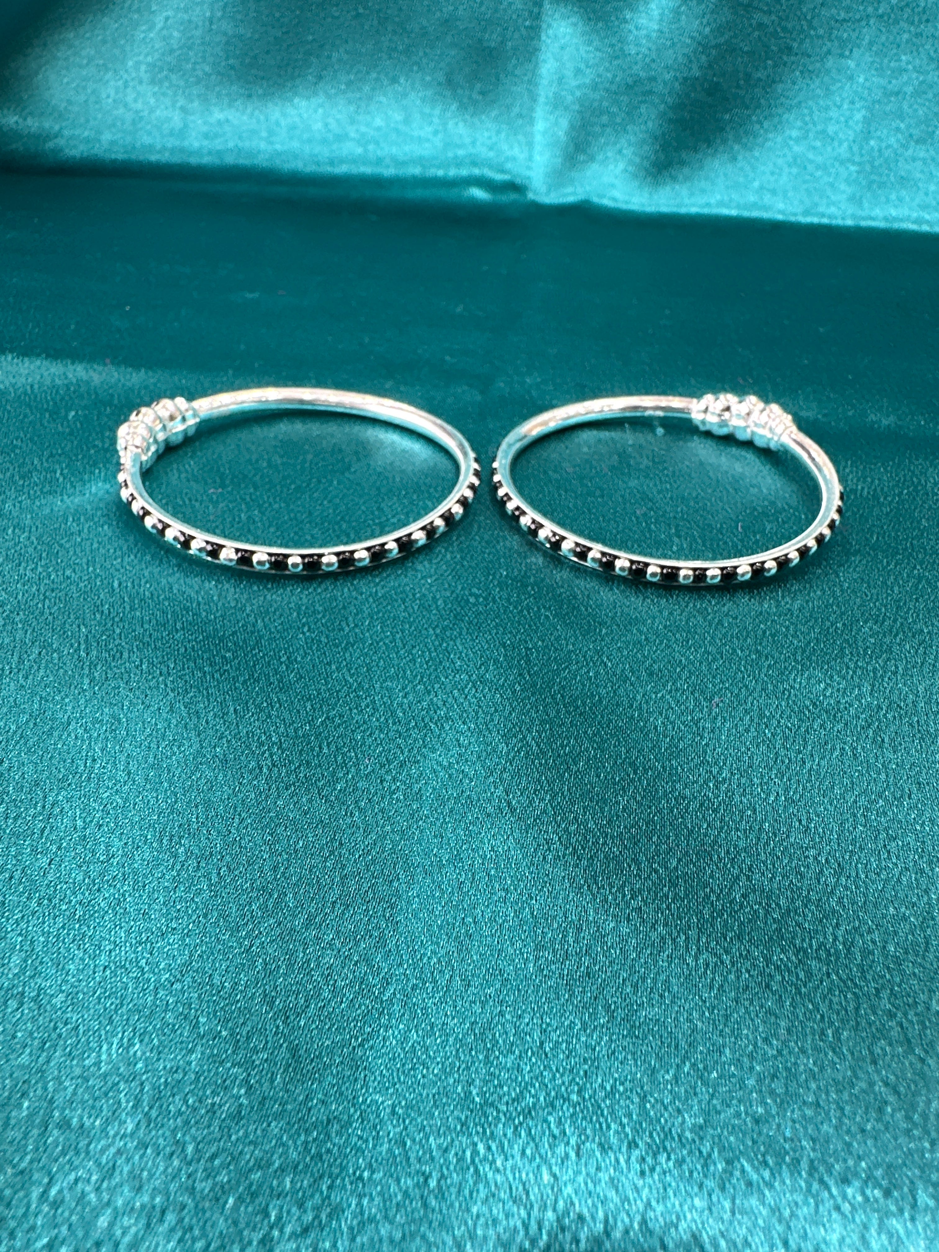 Silver baby bangles with black beads