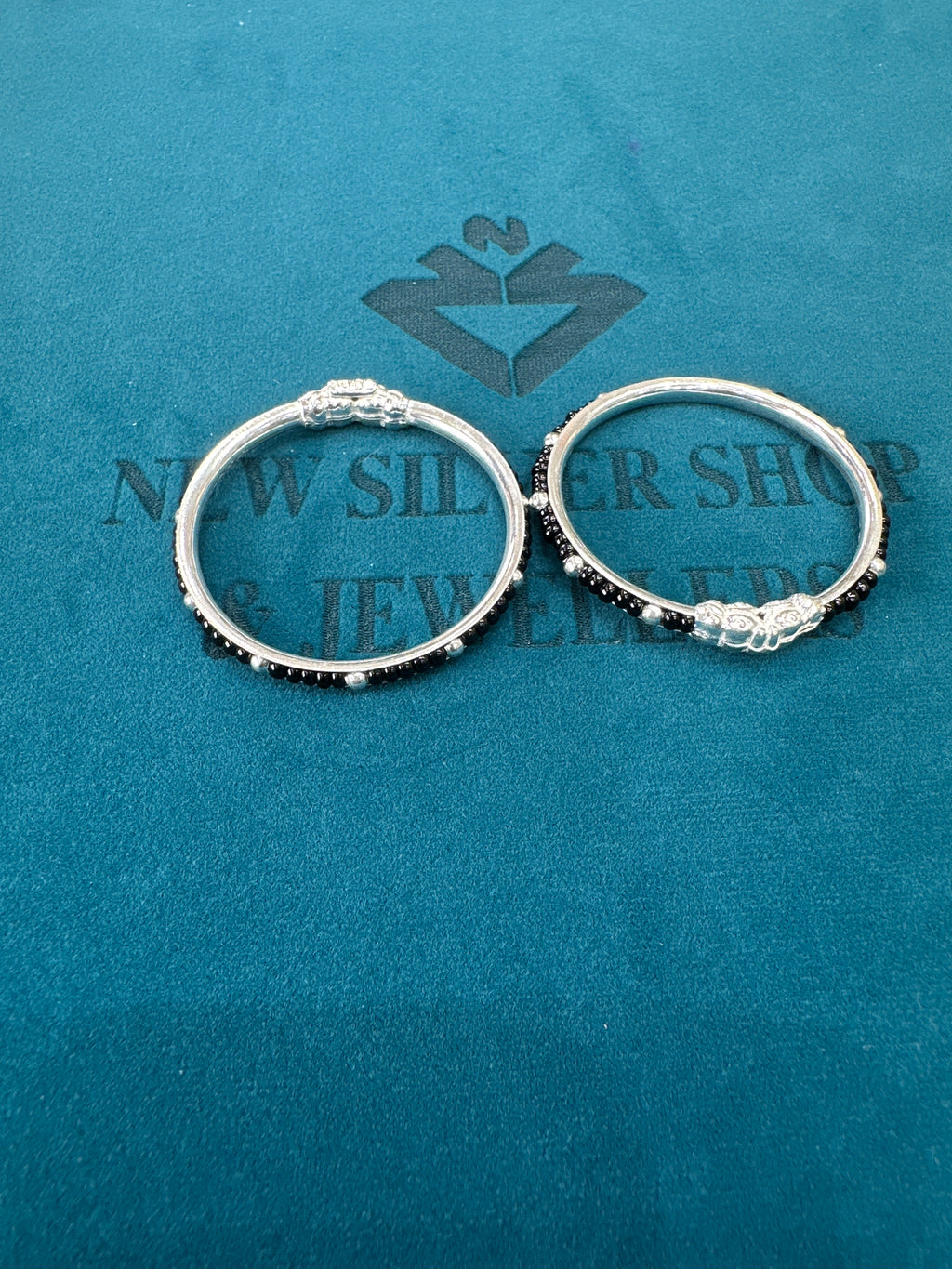 Silver baby bangles with black beads