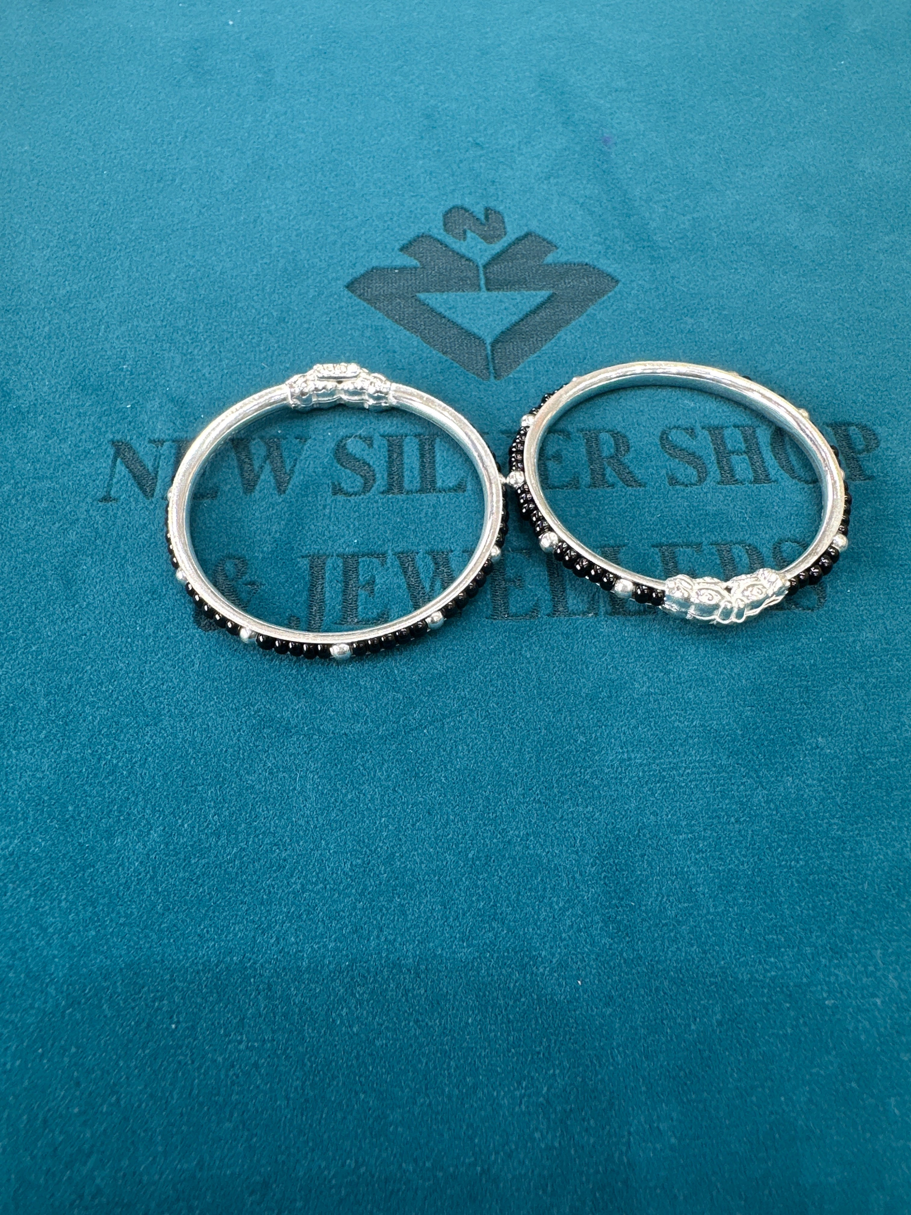 Silver baby bangles with black beads
