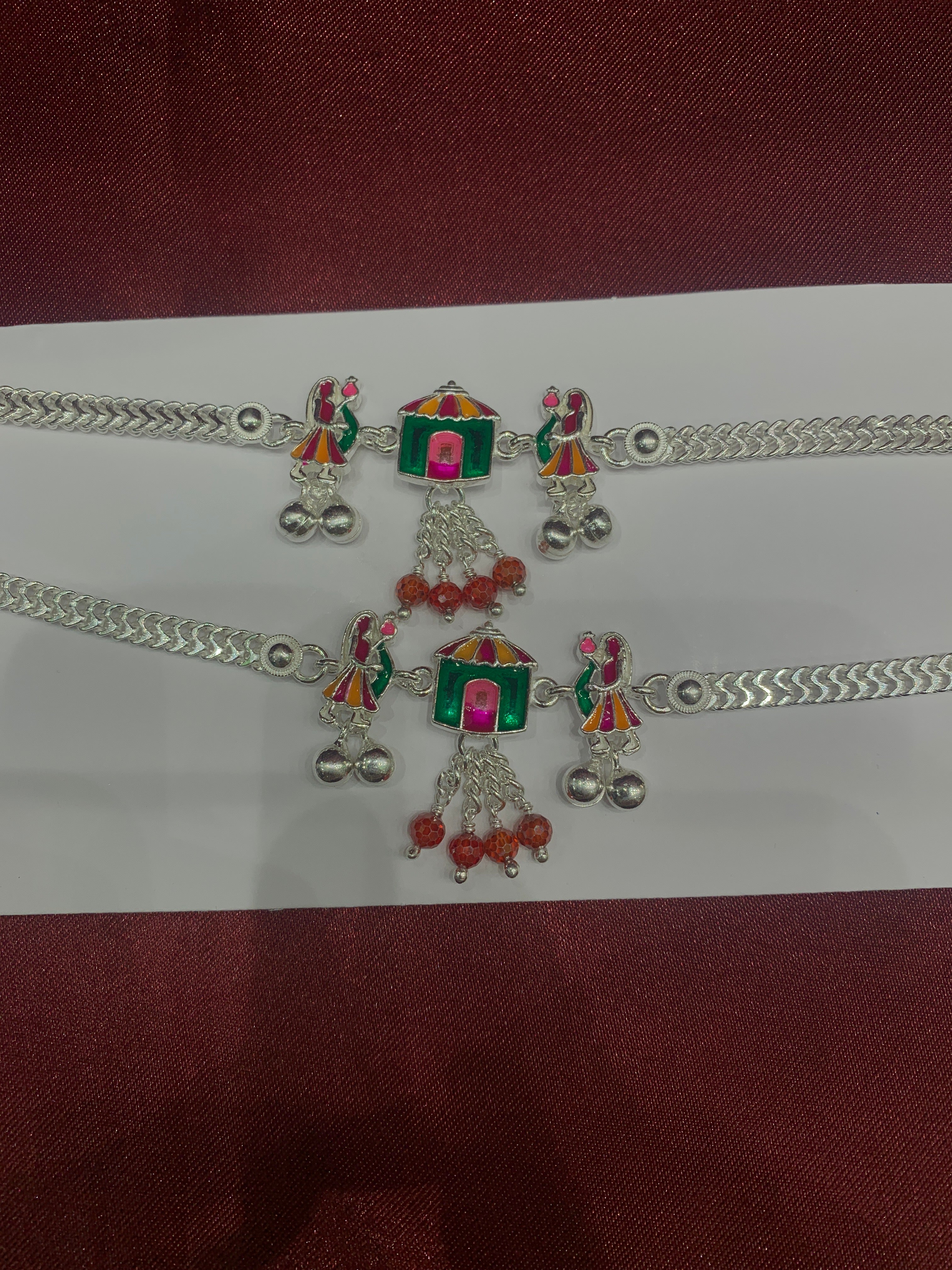 Fancy silver anklets with hut and doll design