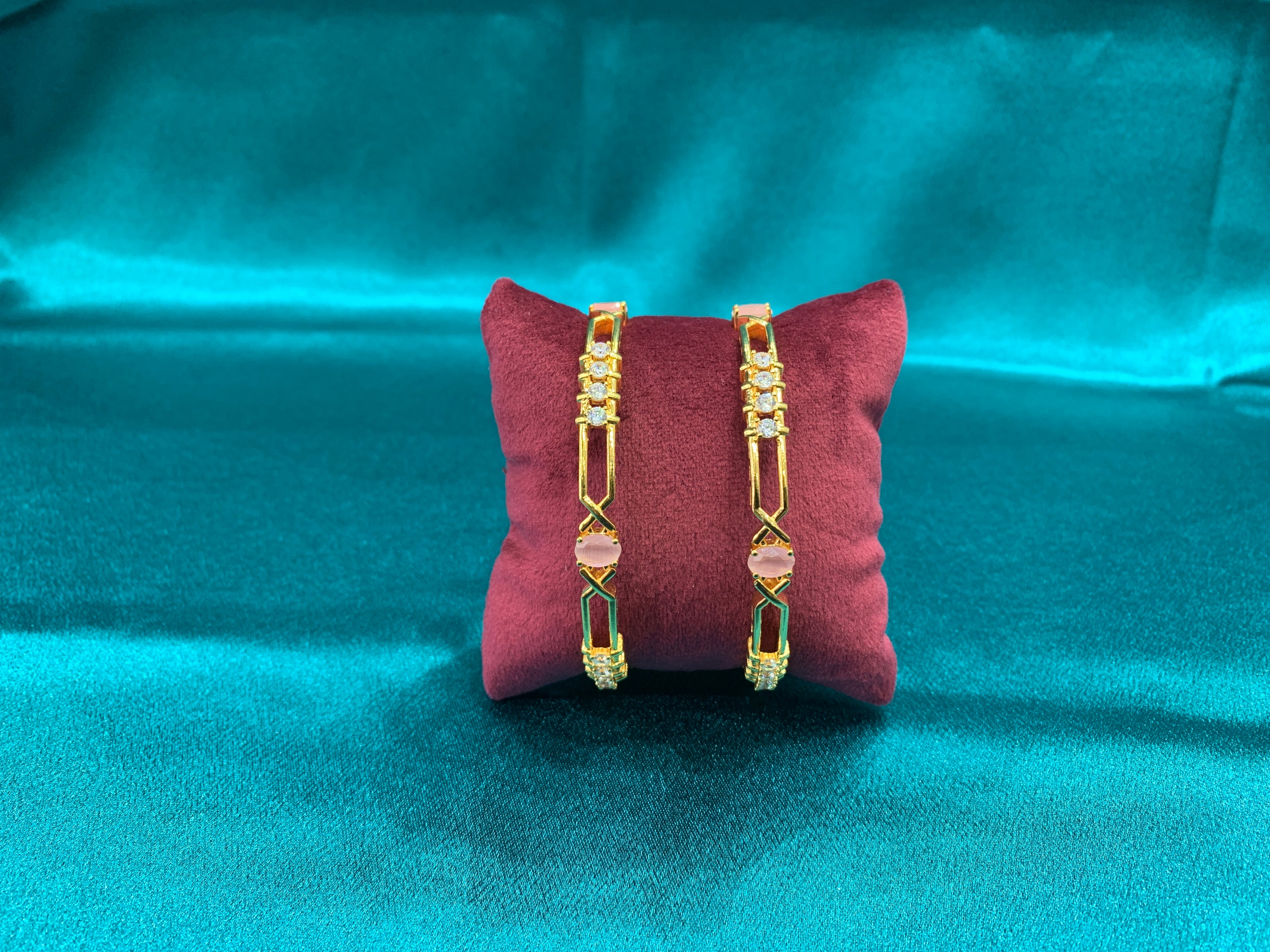 Dazzling gold plated silver bangles with peach CZ diamonds