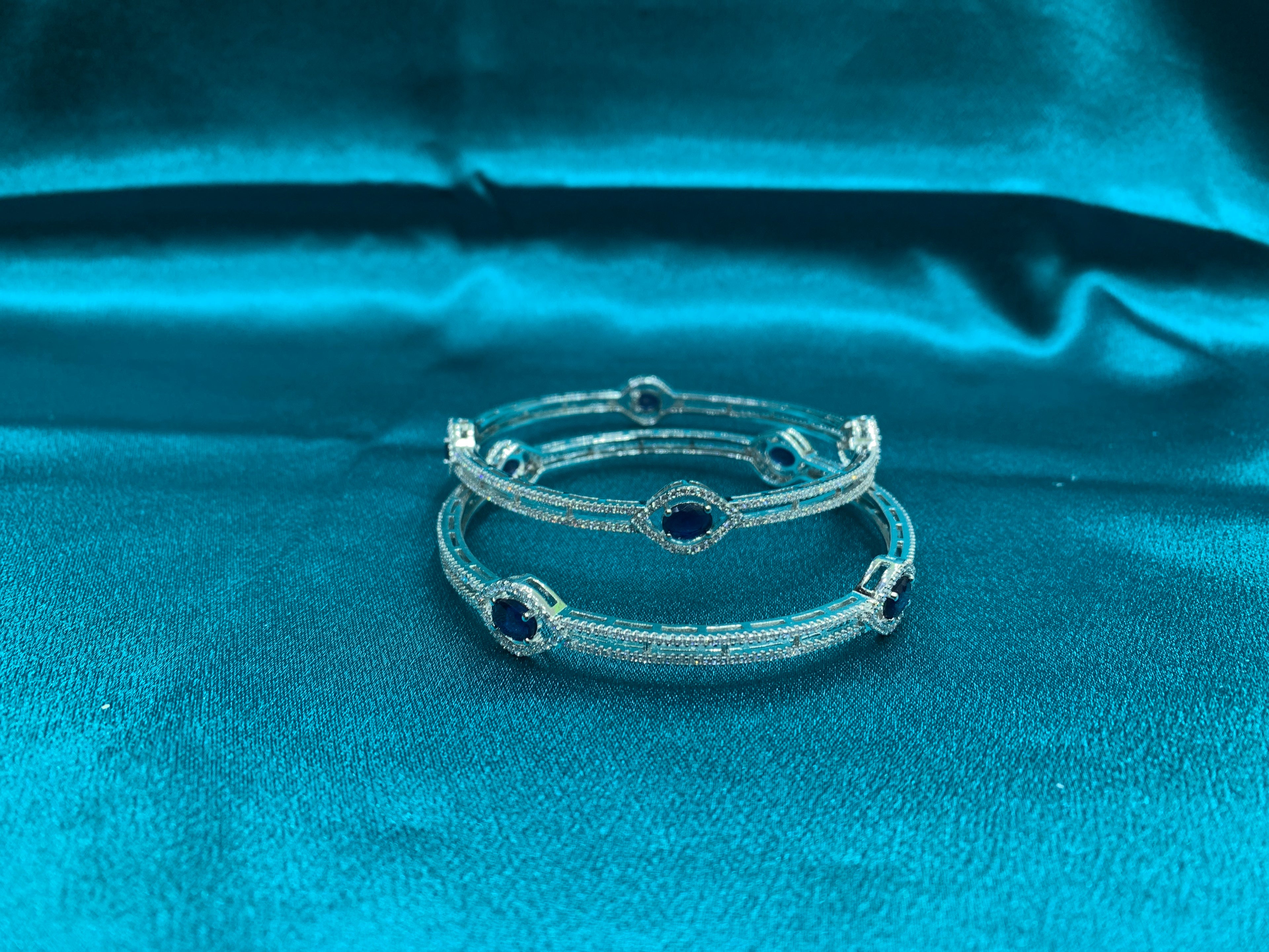 Elegant CZ diamond silver bangles with blue oval CZ diamonds