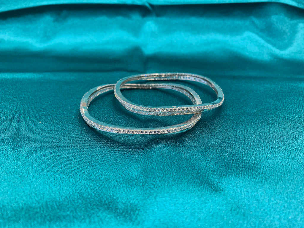 Elegant CZ diamond silver bangles in wavy design