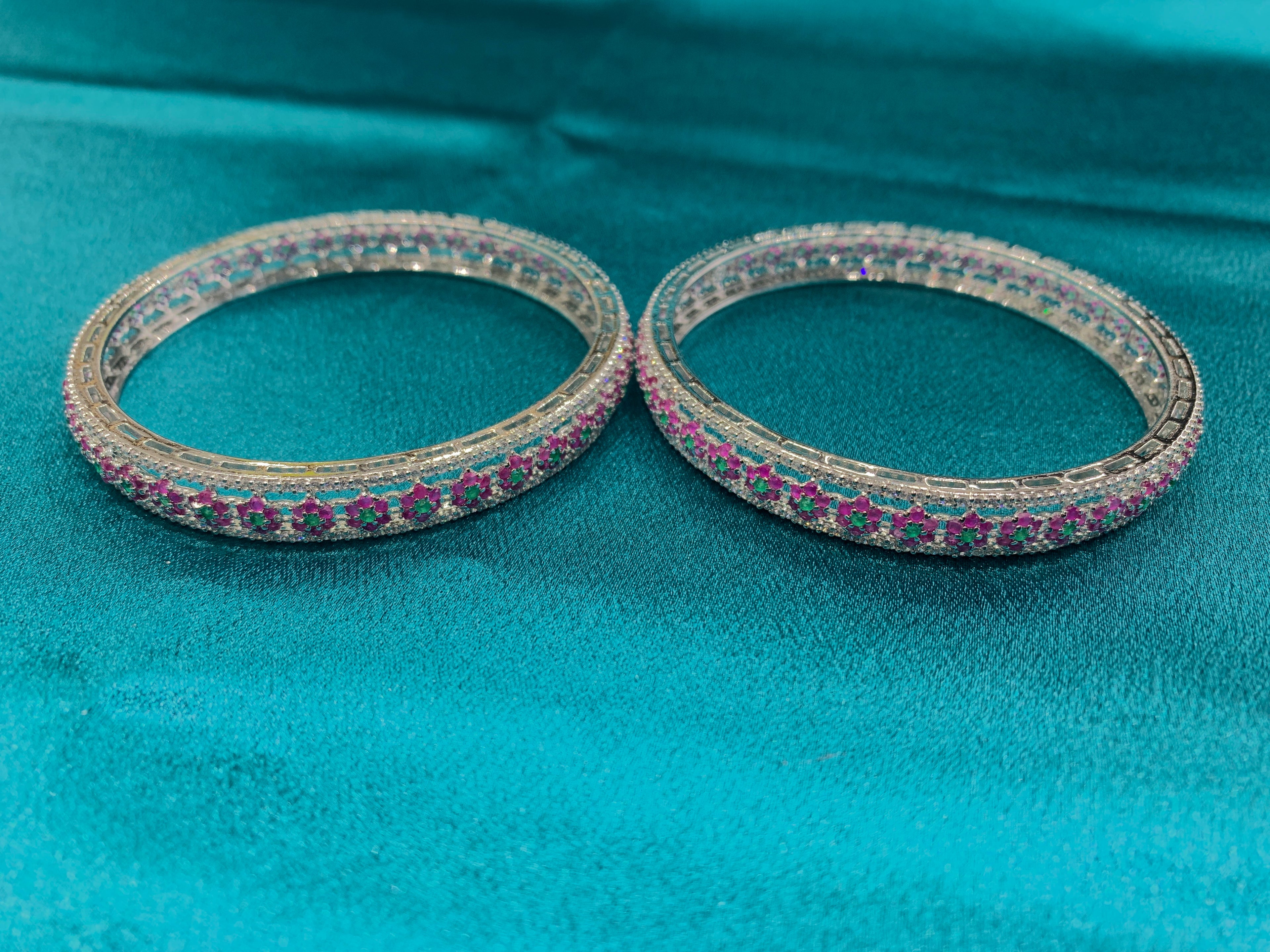 Elegant CZ diamond bangles with green and pink CZ diamonds