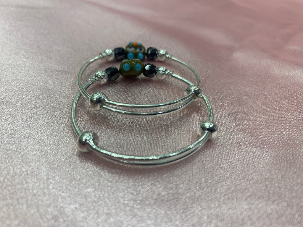 Silver baby bangles with black beads and angry bird