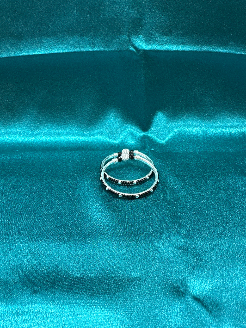 Silver baby bangles with black beads