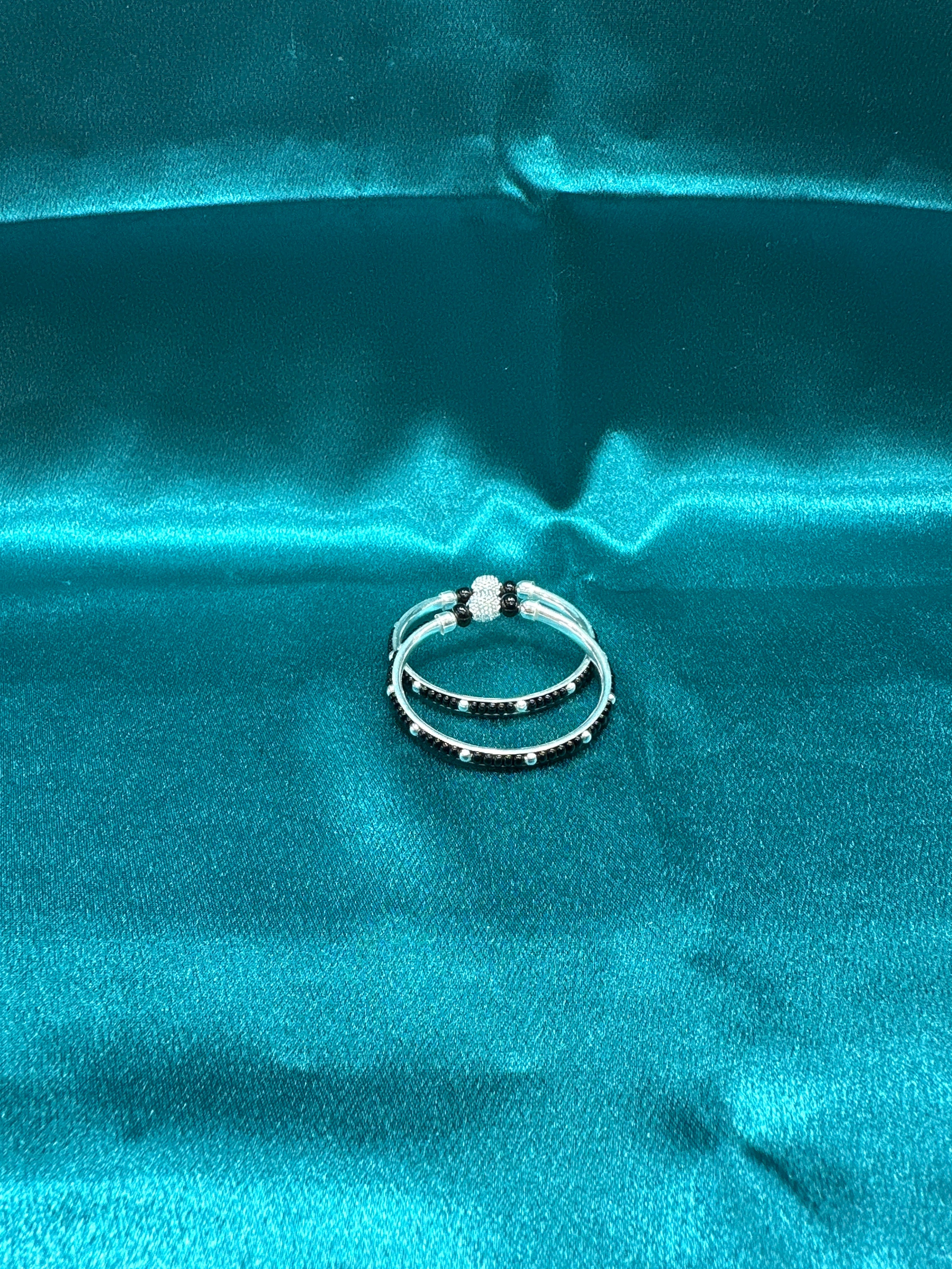 Silver baby bangles with black beads