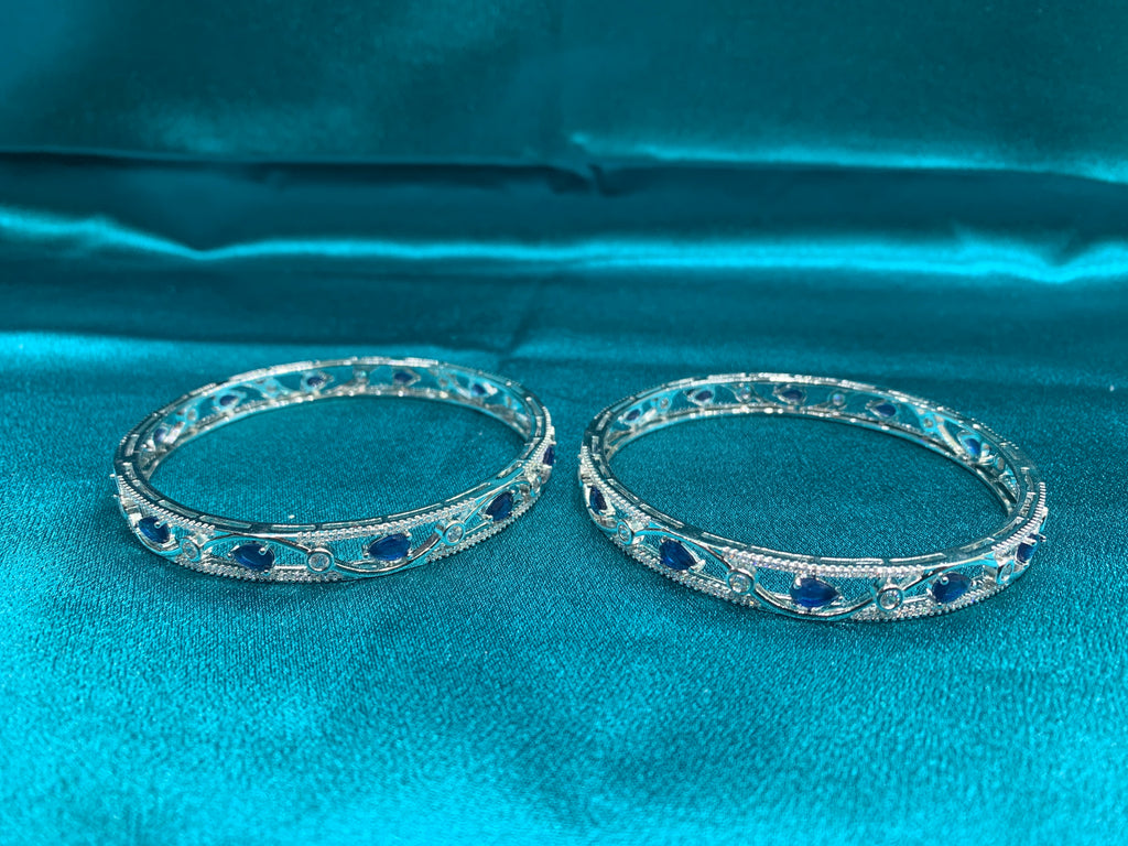 Elegant CZ diamond silver bangles with blue tear drop cut stones