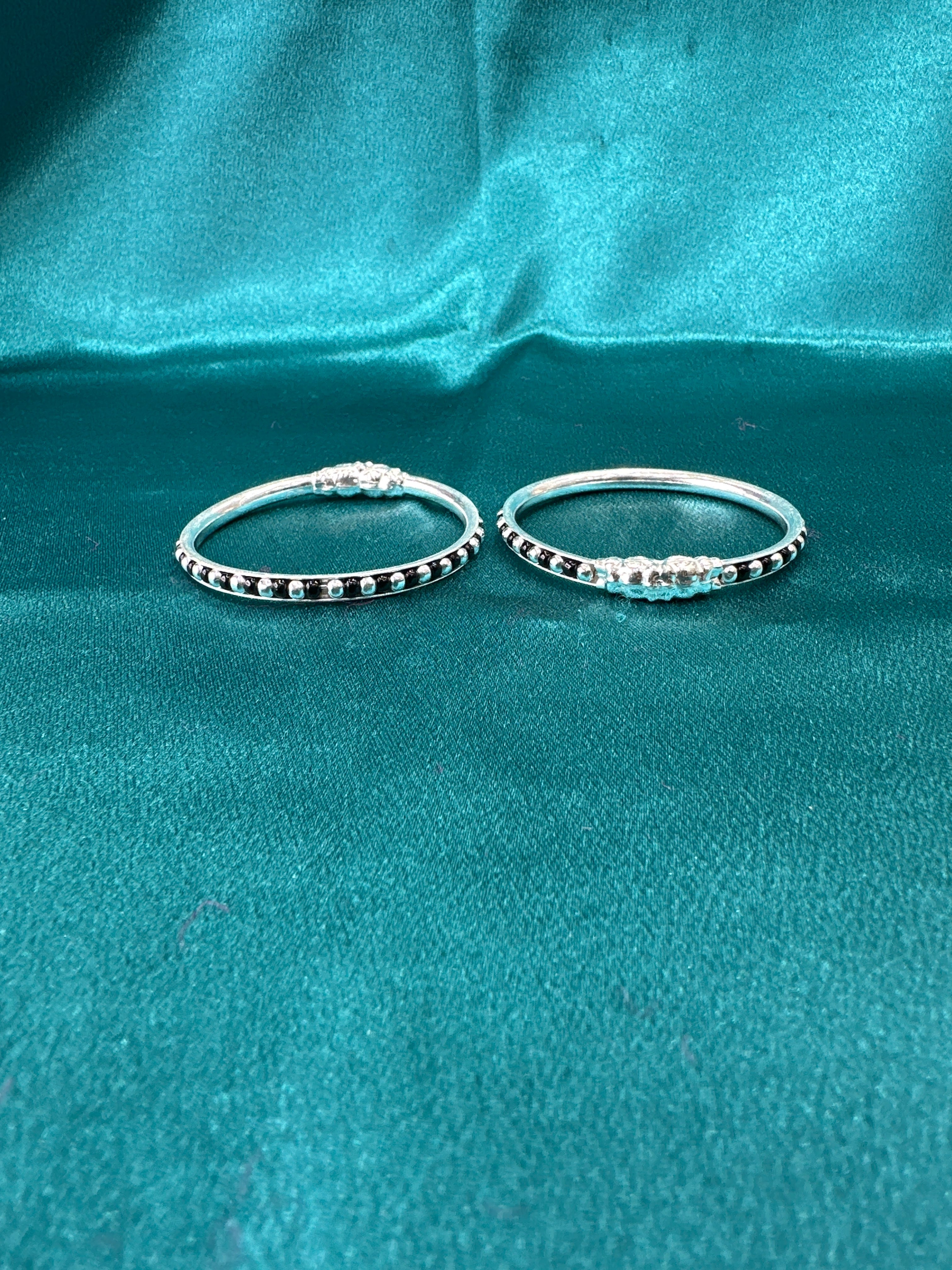 Silver baby bangles with black beads