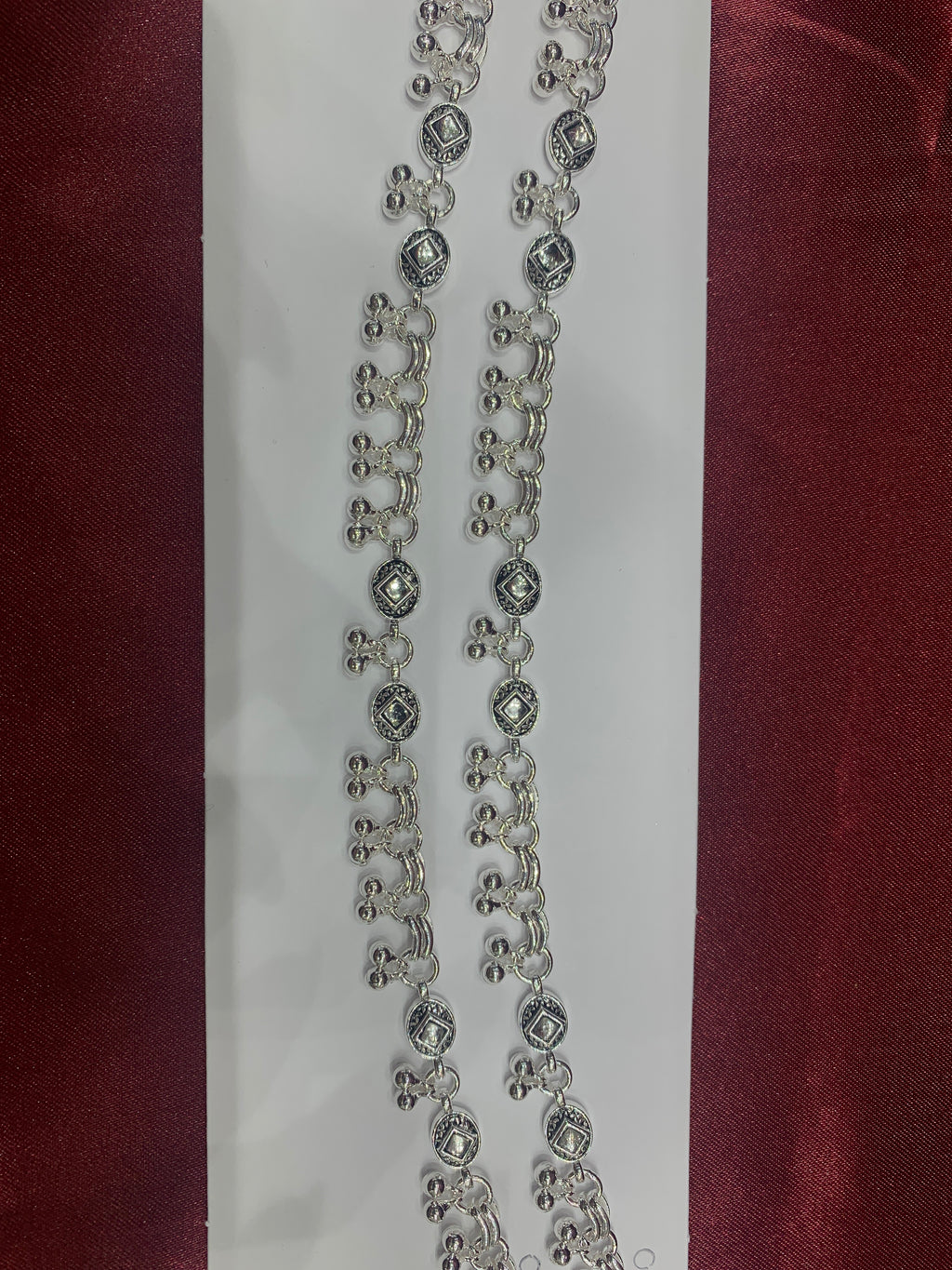 Fancy silver anklets with square stones in center and hanging bells