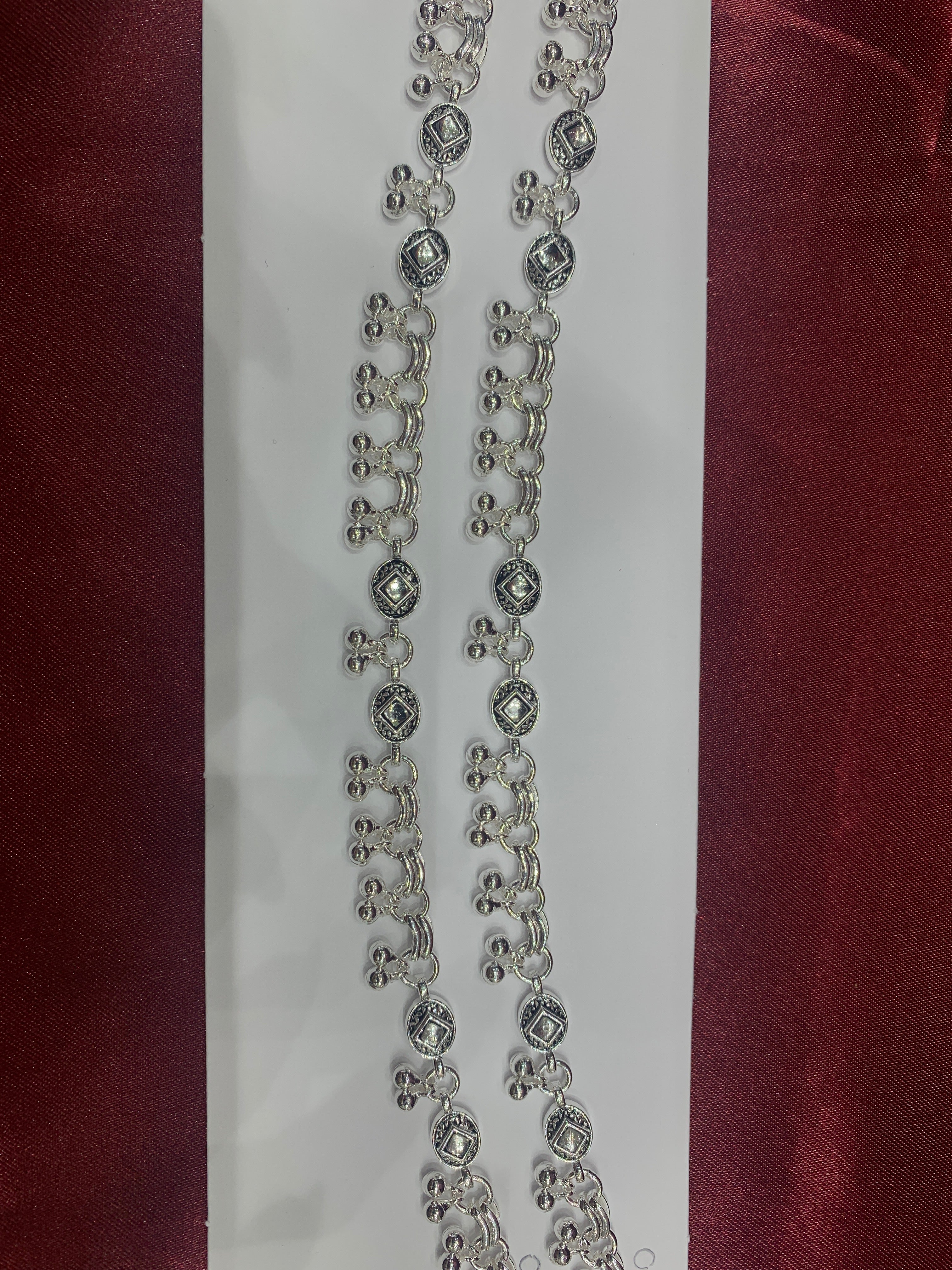 Fancy silver anklets with square stones in center and hanging bells