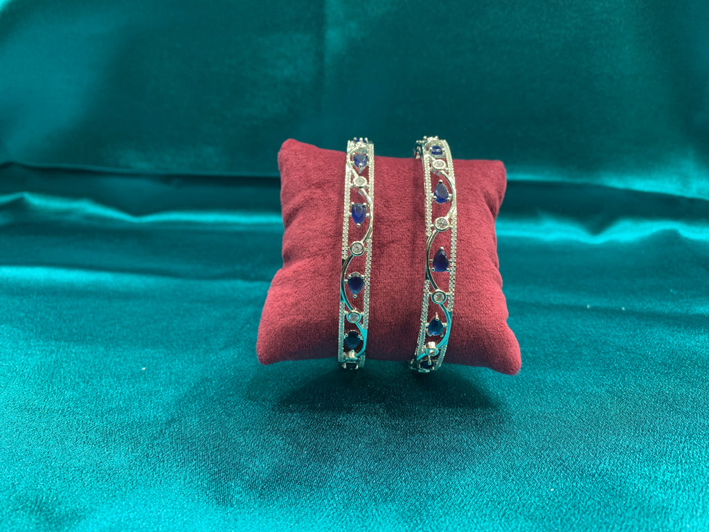 Elegant CZ diamond silver bangles with blue tear drop cut stones