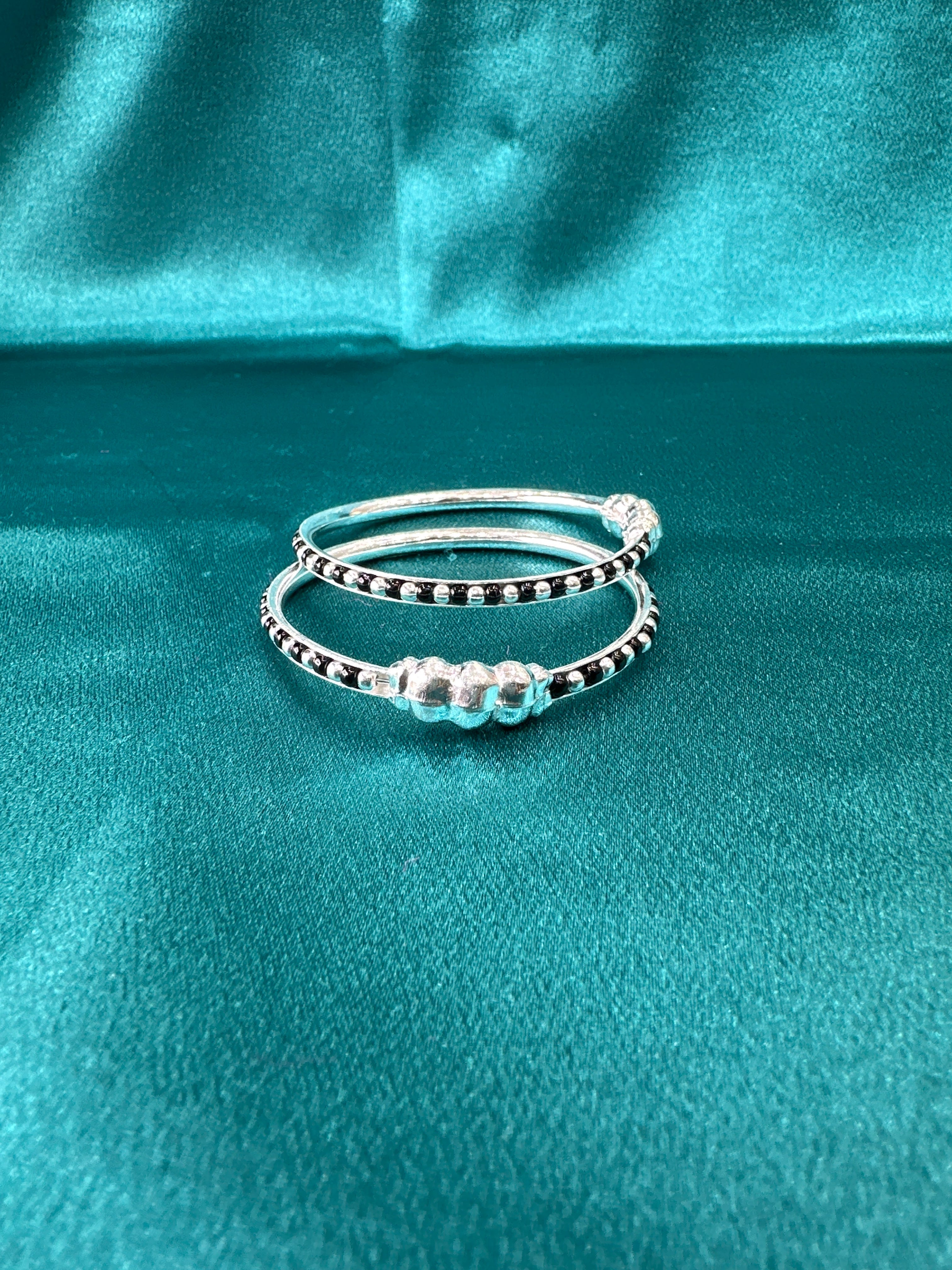 Silver baby bangles with black beads