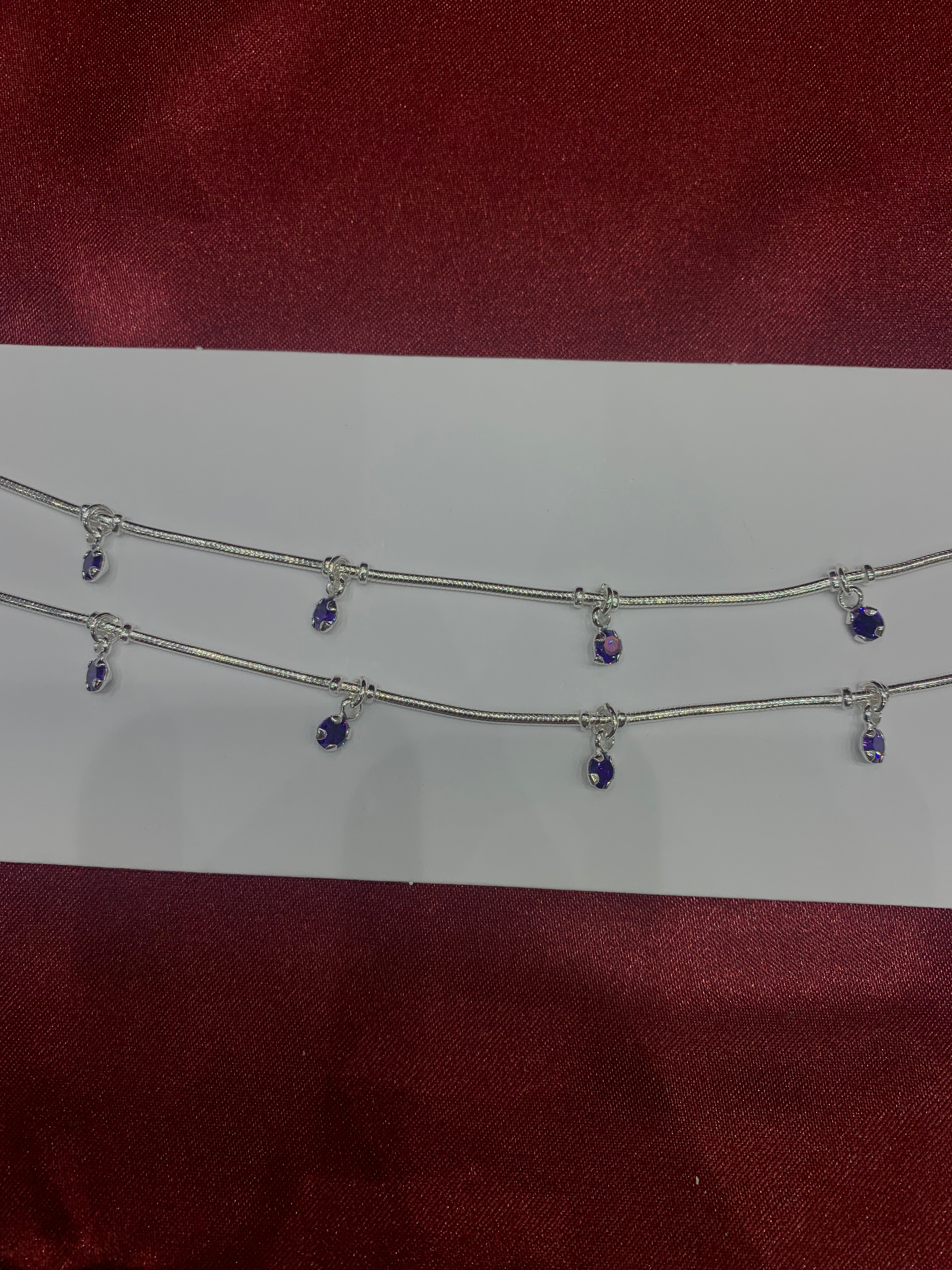 Fancy silver anklets with purple hanging CZ diamonds