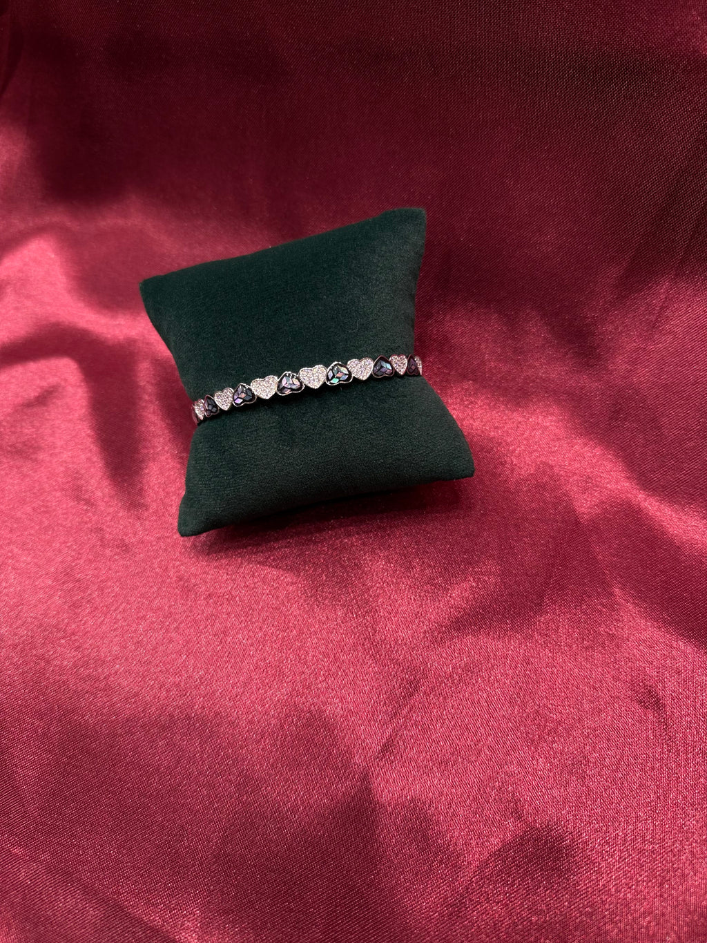Fancy silver bangle with shimmering hearts