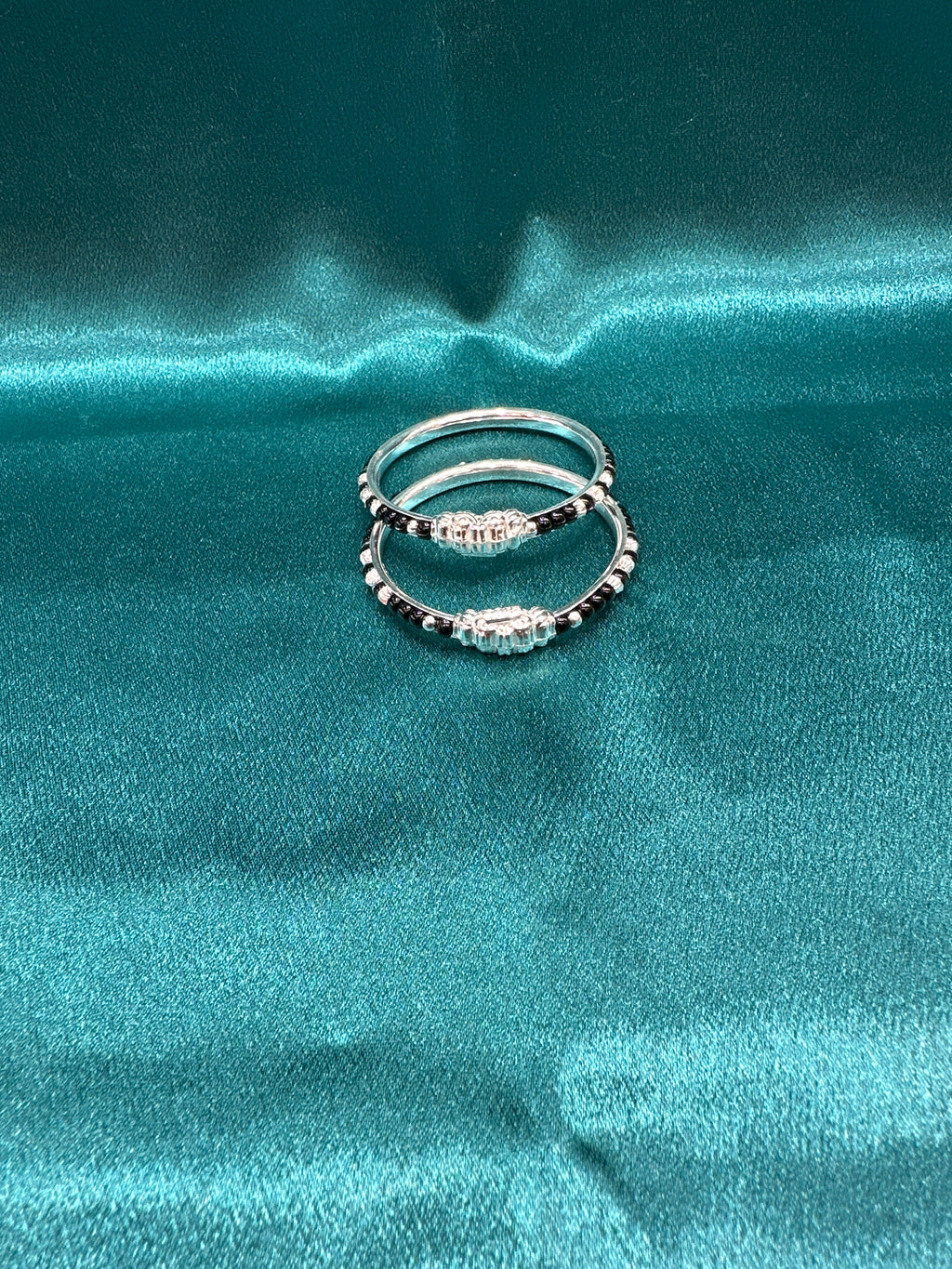 Silver baby bangles with black beads