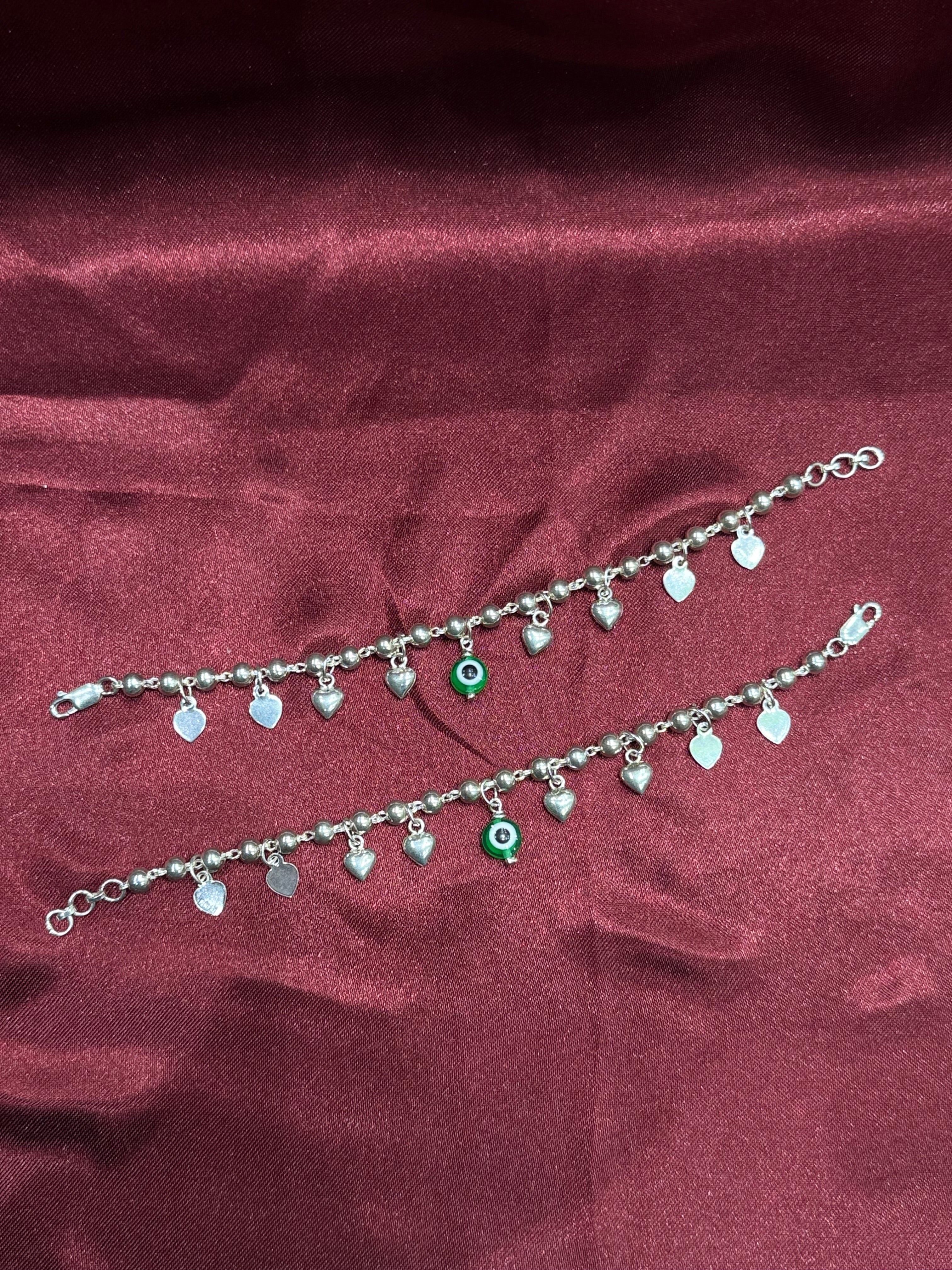 Kids fancy silver anklets with hanging heart charms and green evil eye (6-9 year old)