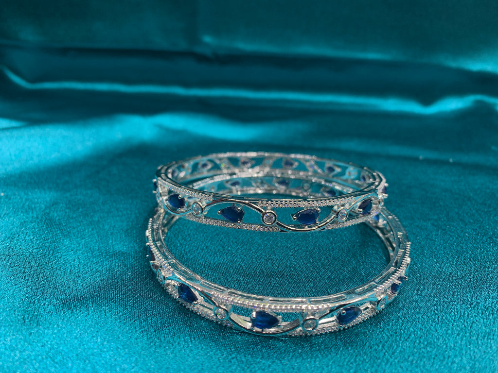 Elegant CZ diamond silver bangles with blue tear drop cut stones