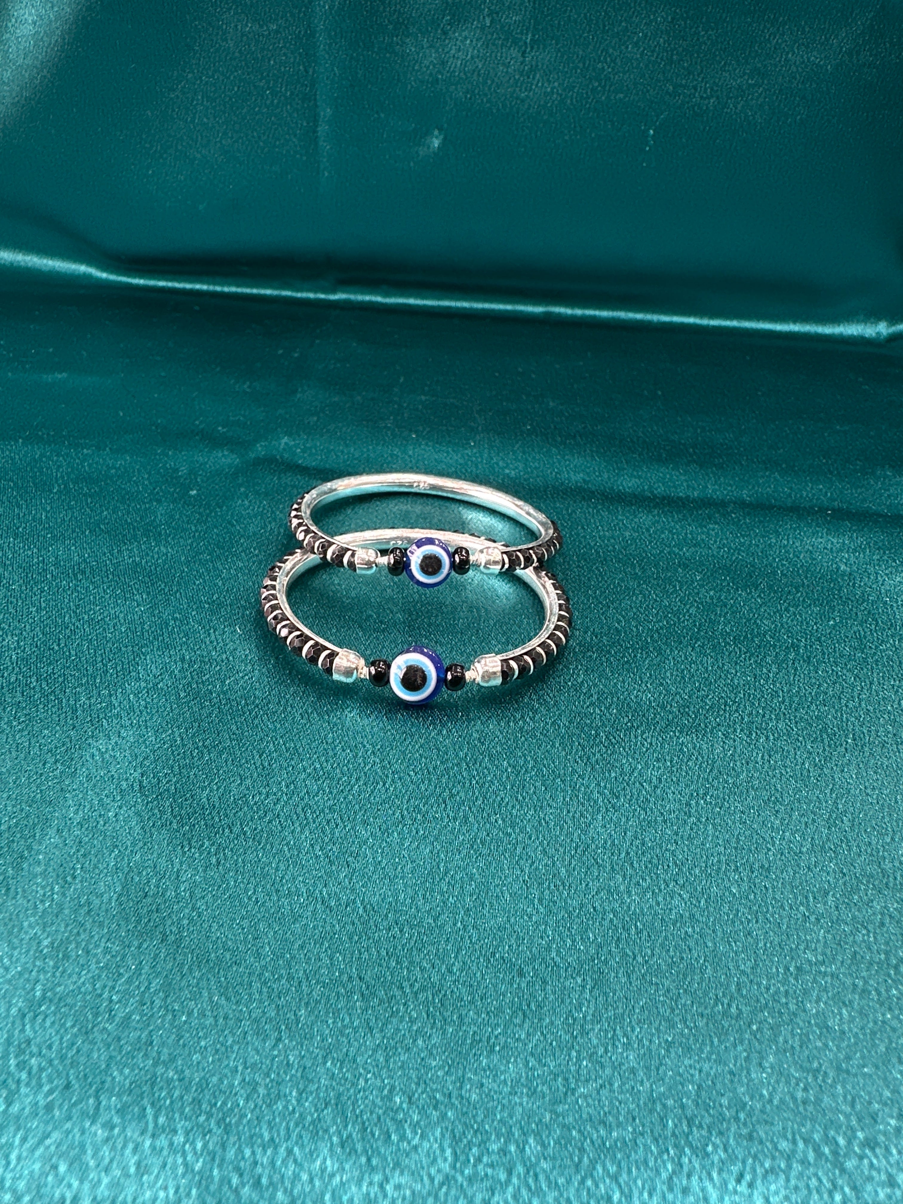 Silver baby bangles with black beads